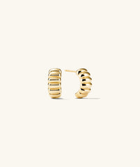 Charlotte Hoops: A pair of elegant gold earrings inspired by the iconic French dessert, adding a sweet touch to your style.