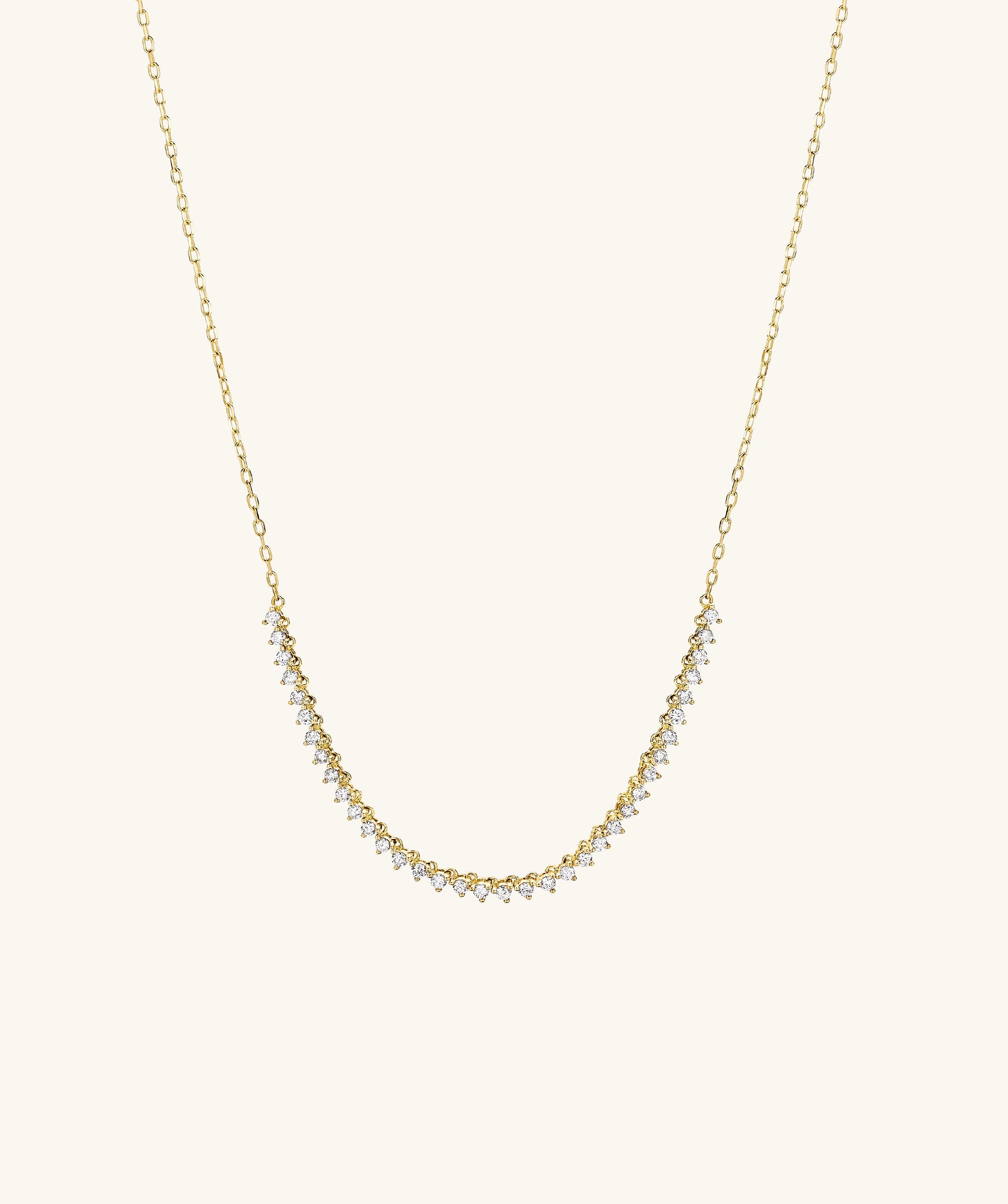 Diamond Half Tennis Necklace: A close-up of a handcrafted 14k gold chain adorned with responsibly sourced diamonds, capturing a sparkling elegance in its design.