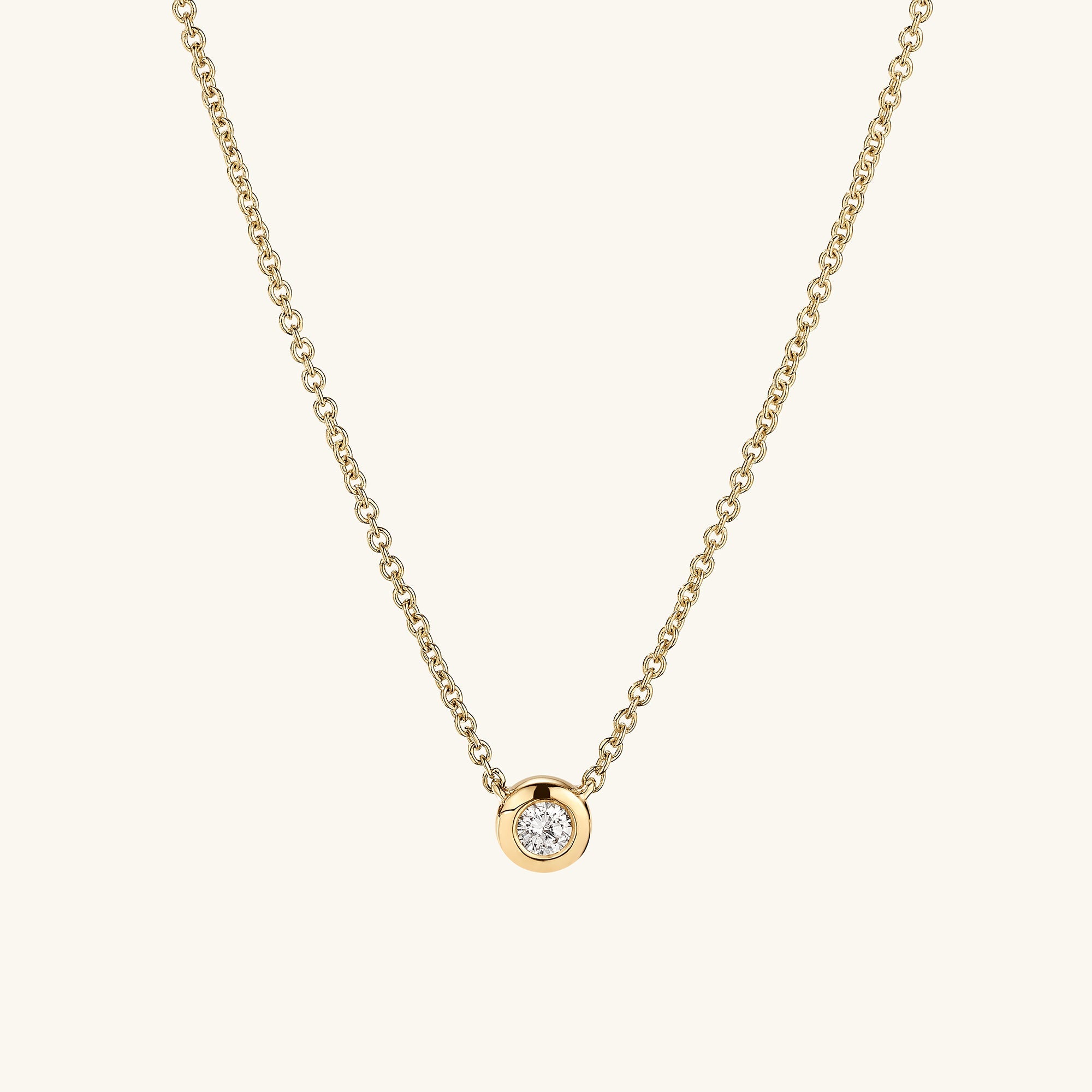 Diamond Necklace featuring a 14k solid gold chain and a round cut, bezel-set, responsibly sourced diamond pendant. Perfect for timeless elegance and lasting quality.