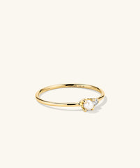 Pearl and Diamond Stacker Ring: A 14k gold ring featuring a central freshwater pearl flanked by diamonds, handcrafted for elegance and versatility.