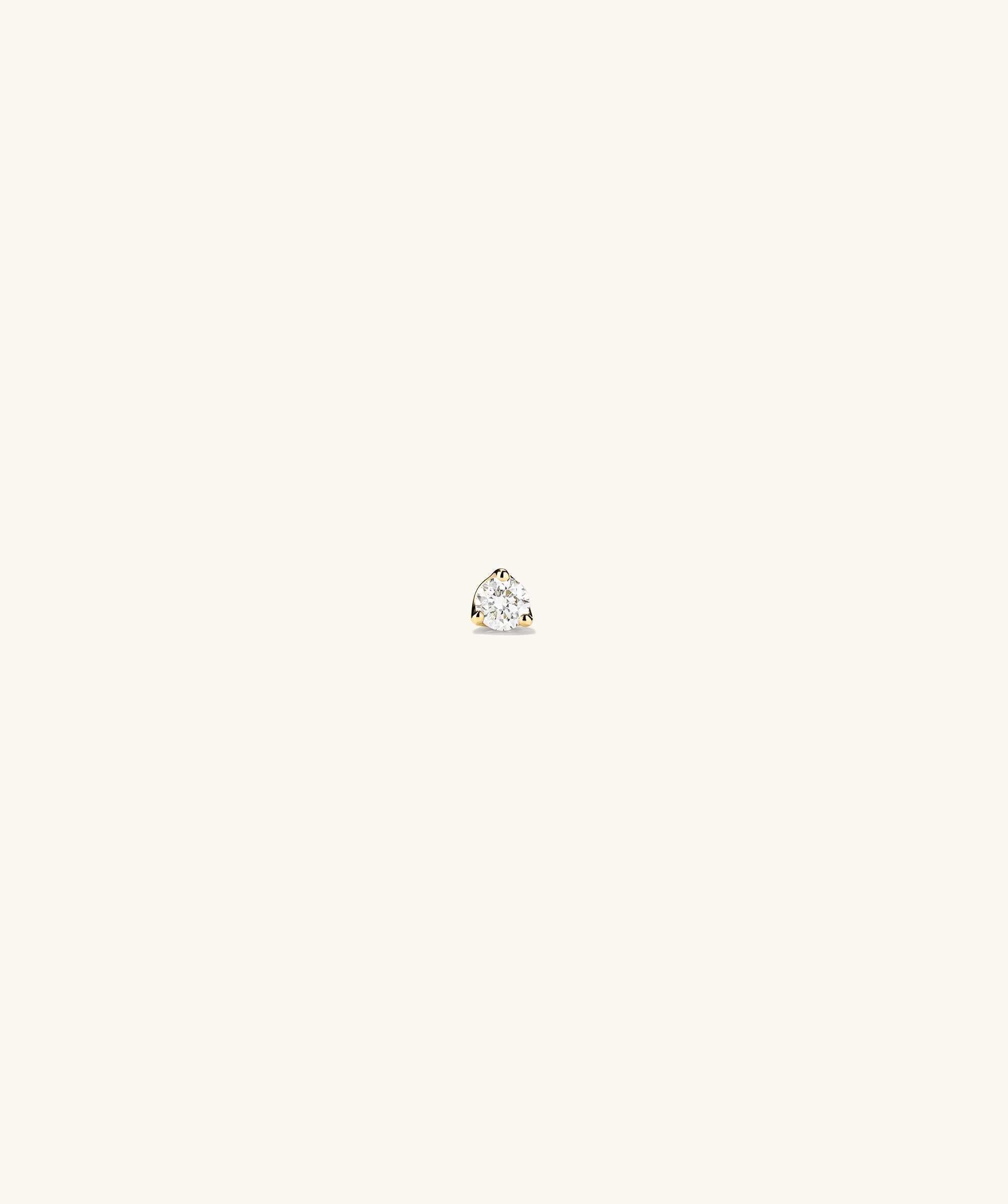 Piercing Studio - Diamond Mini Flat Back Stud on display, showcasing a single diamond on a white surface with a minimalist design, highlighting its elegant simplicity.