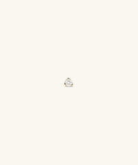 Piercing Studio - Diamond Mini Flat Back Stud on display, showcasing a single diamond on a white surface with a minimalist design, highlighting its elegant simplicity.