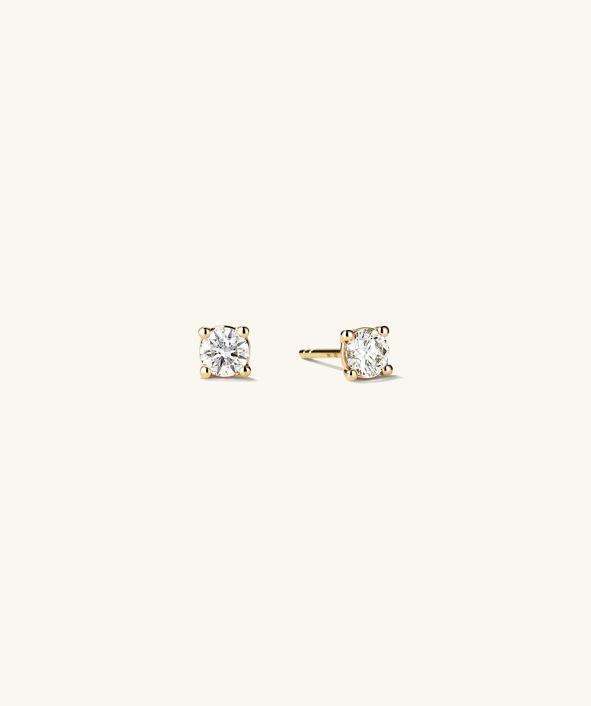 Lab Grown Diamond Round Studs 0.5 TCW feature sparkling, lab-grown diamonds set in 14k solid gold, offering ethical brilliance and value.