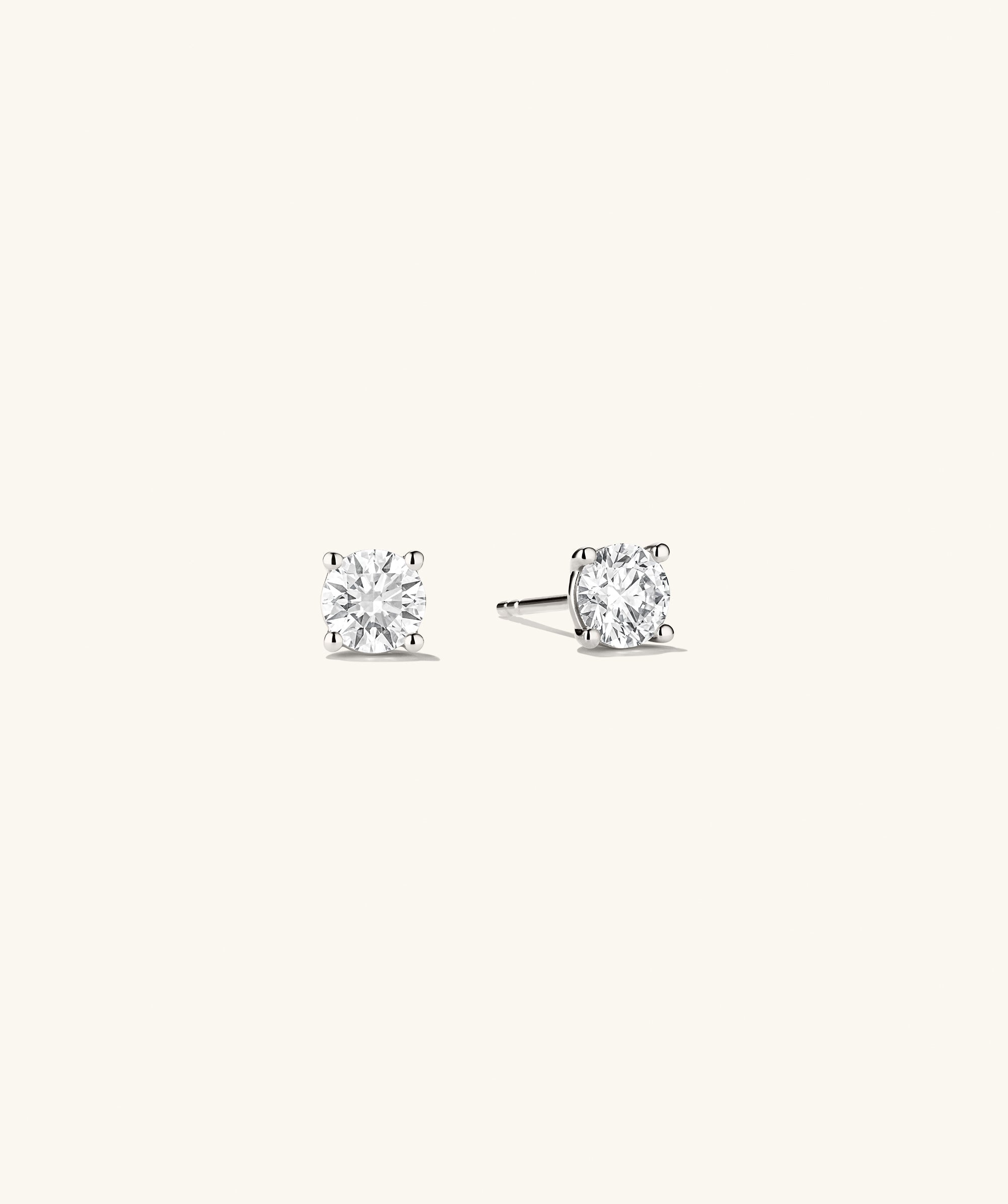Lab Grown Diamond Round Studs 1 TCW, featuring a pair of sparkling earrings with lab grown diamonds set in 14k solid gold, showcasing their brilliance.