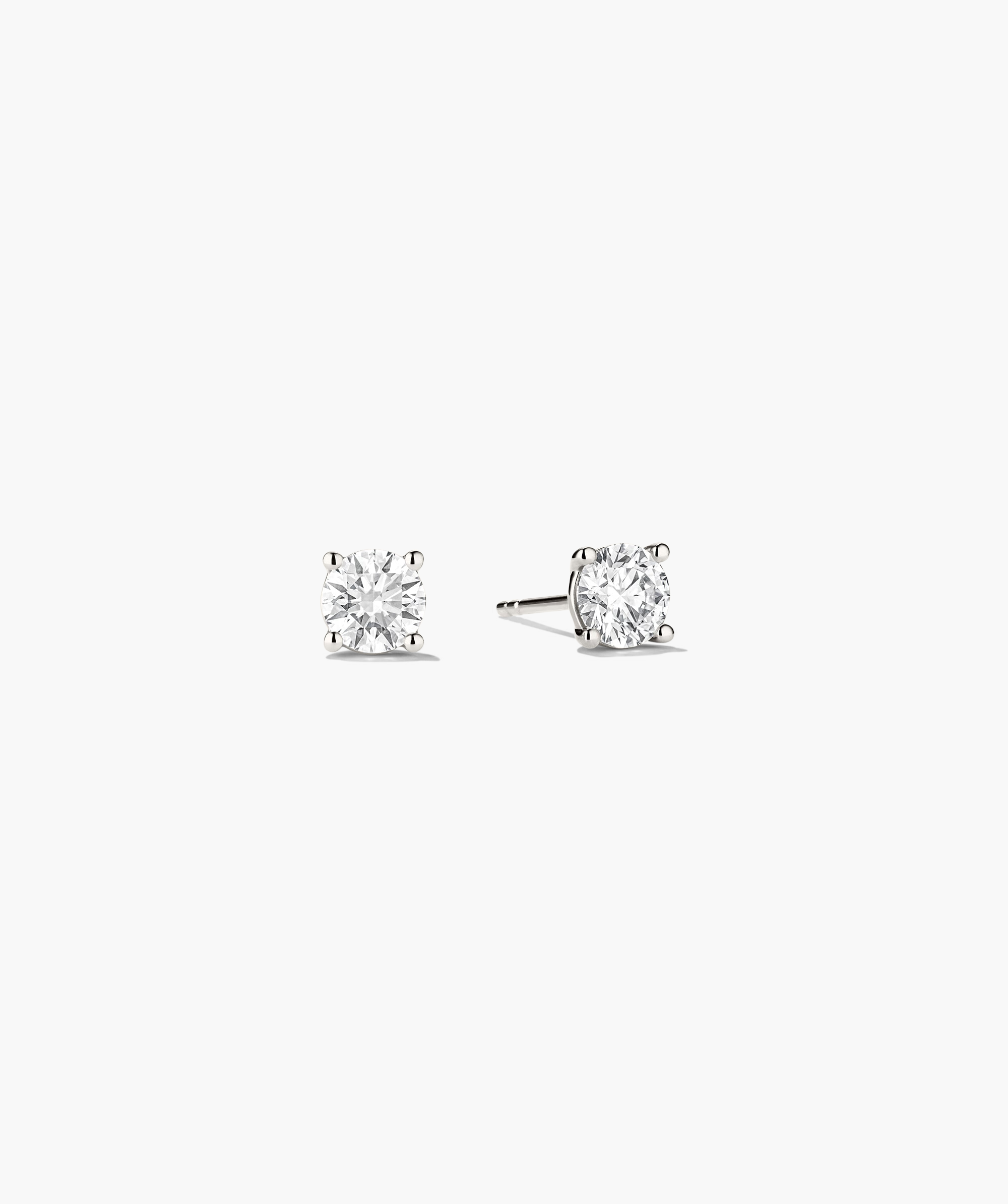 Lab Grown Diamond Round Studs 1 TCW, featuring a pair of sparkling earrings with lab grown diamonds set in 14k solid gold, showcasing their brilliance.