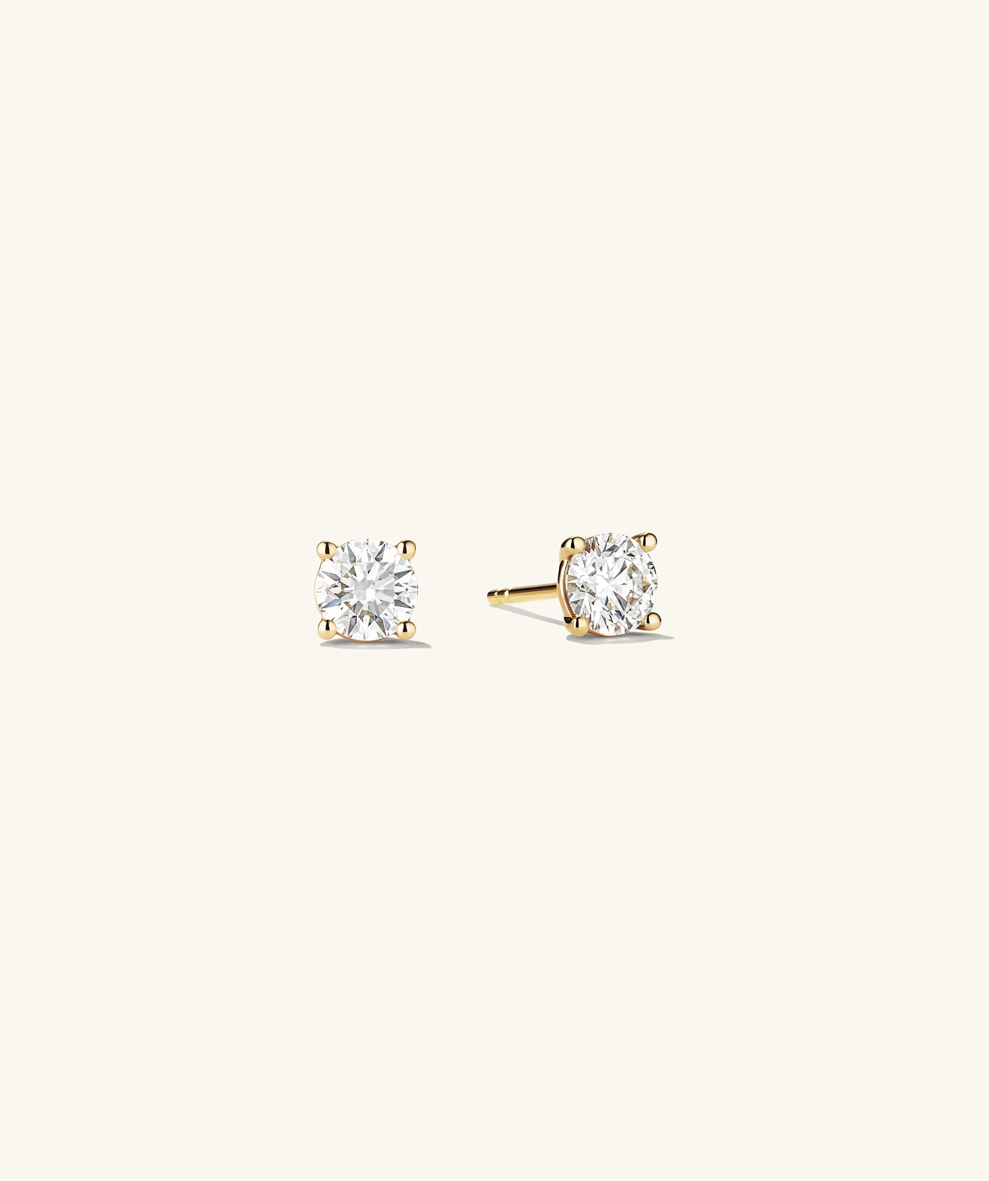 Lab Grown Diamond Round Studs 1 TCW, featuring sparkling lab-grown diamonds set in 14k solid gold, showcased in a detailed close-up view.