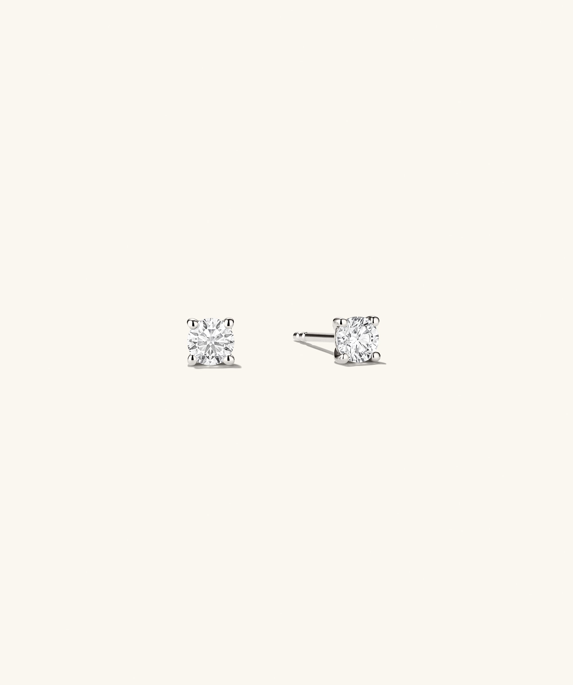 Large Diamond Studs with a unique diamond setting, showcasing a close-up view of the intricate craftsmanship and timeless design of these handcrafted earrings.