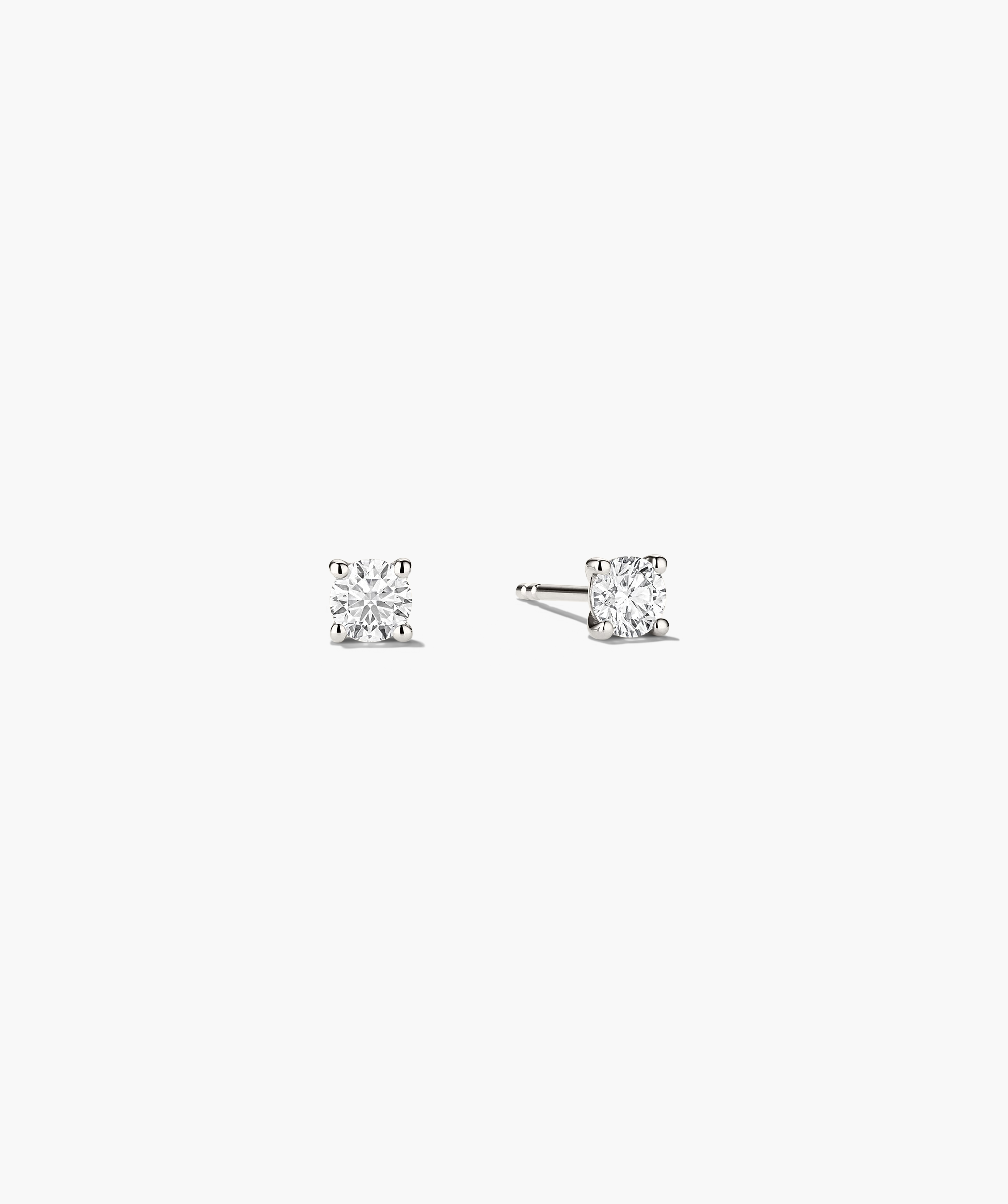 Large Diamond Studs with a unique diamond setting, showcasing a close-up view of the intricate craftsmanship and timeless design of these handcrafted earrings.