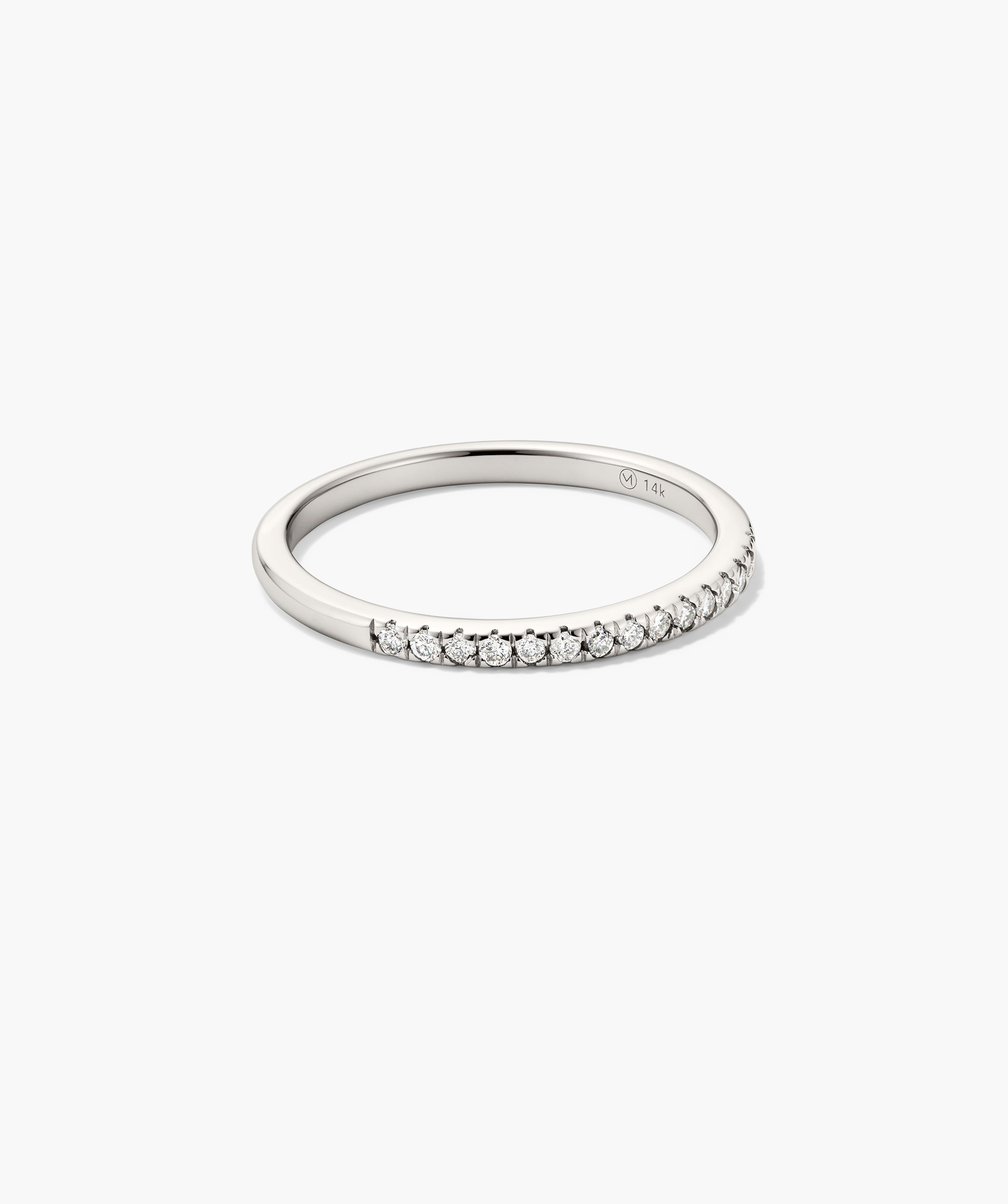 Diamonds Team Ring, a delicate silver ring adorned with diamonds, perfect for stacking and enhancing any outfit with its elegant sparkle.