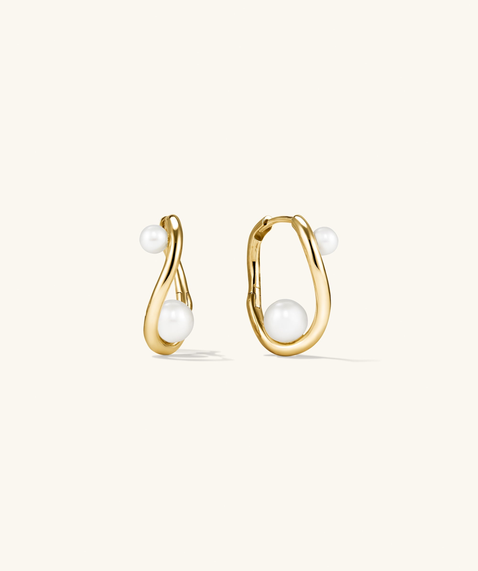 DÃ´me Figure Pearl Hoops featuring interwoven gold design with varying-sized pearls, perfect for elevating any outfit with elegance and sophistication.