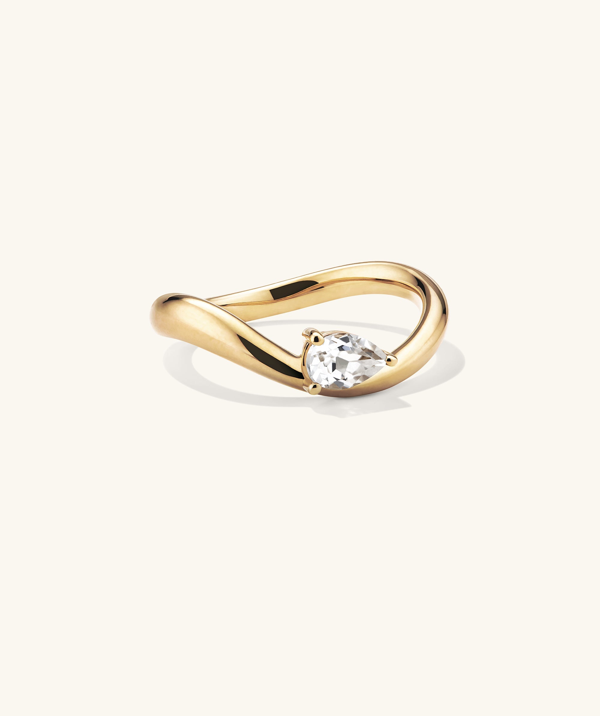 DÃ´me Figure Balance Ring showcasing a pear cut gemstone floating elegantly above the band, ideal for layering with other DÃ´me Figure Rings.
