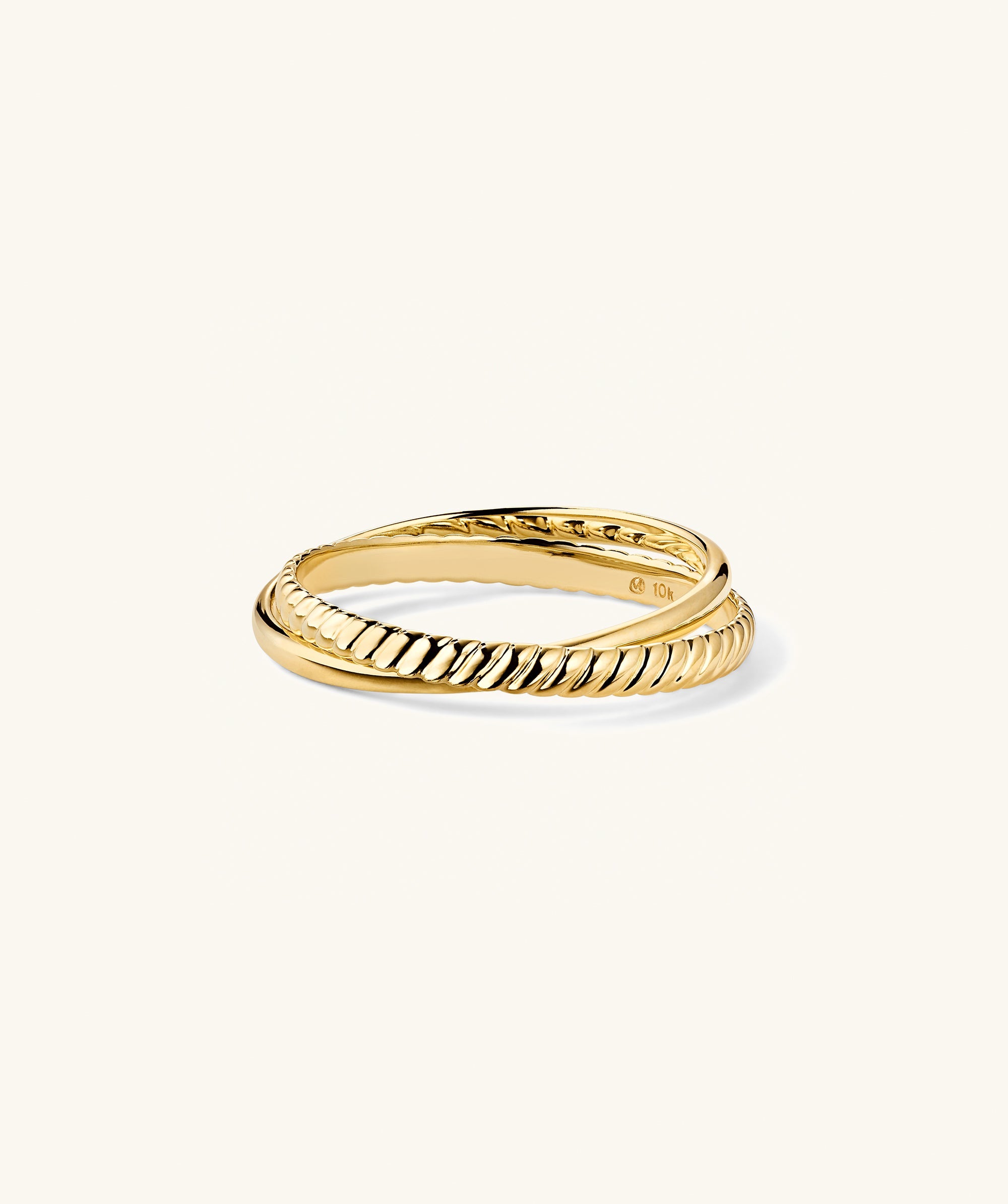 Duo Ring featuring two interlocking bands; one smooth, one twisted-rope, crafted in 14k gold, forming a minimalist, knotted style.