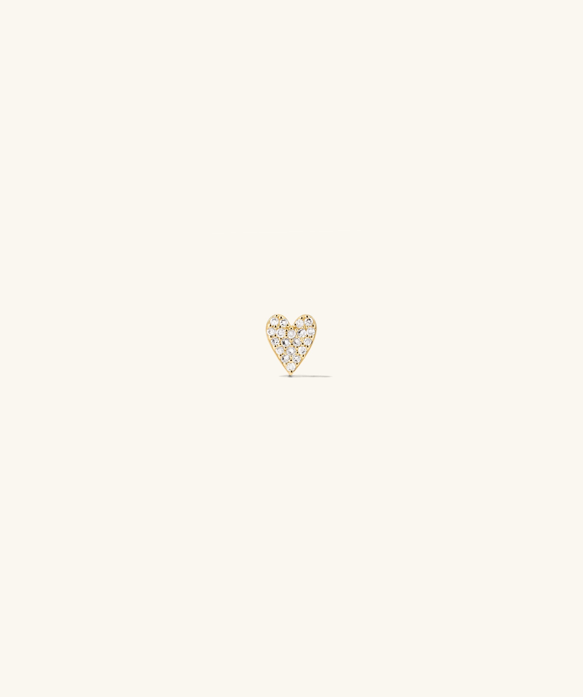 Piercing Studio - PavÃ© Diamond Heart Flat Back Stud featuring a heart-shaped design adorned with small white dots, creating a playful and elegant statement piece.