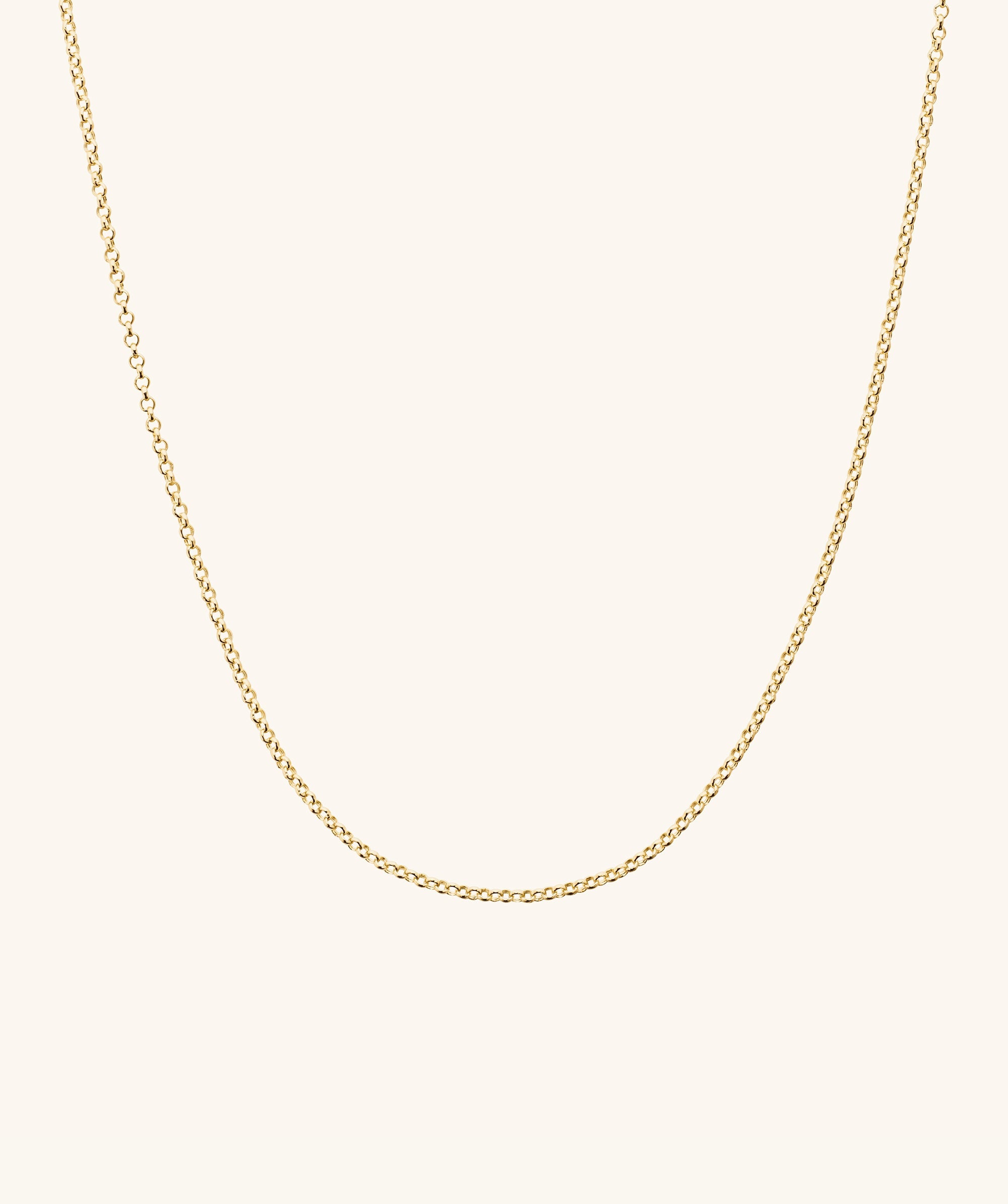 Baby Rolo Chain: A delicate gold chain designed for everyday wear, shown on a plain white background.
