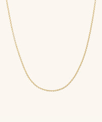 Baby Rolo Chain: A delicate gold chain designed for everyday wear, shown on a plain white background.