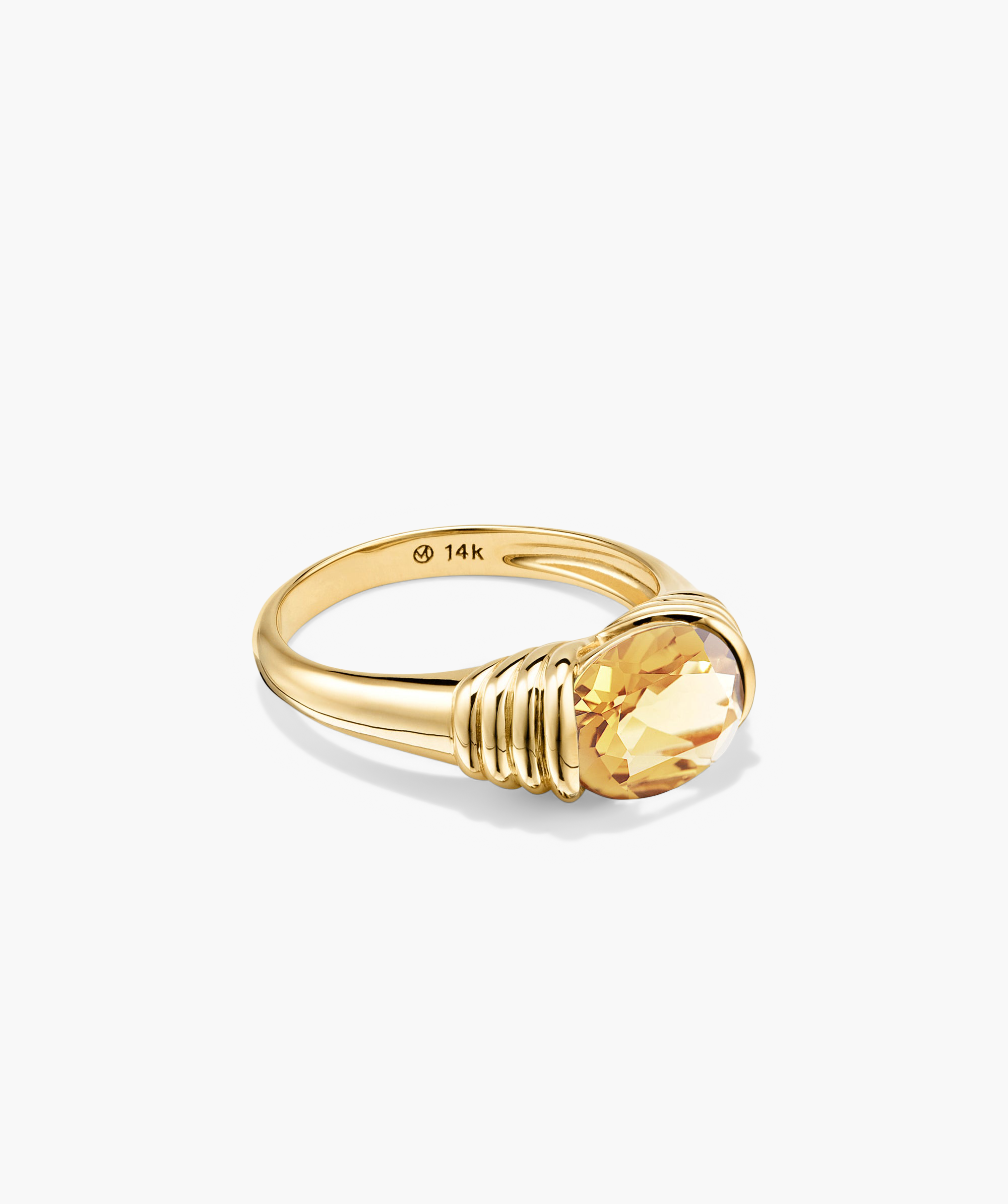 Heirloom Ring: A gold ring featuring a large gemstone, designed to be a standout piece in any jewelry collection.