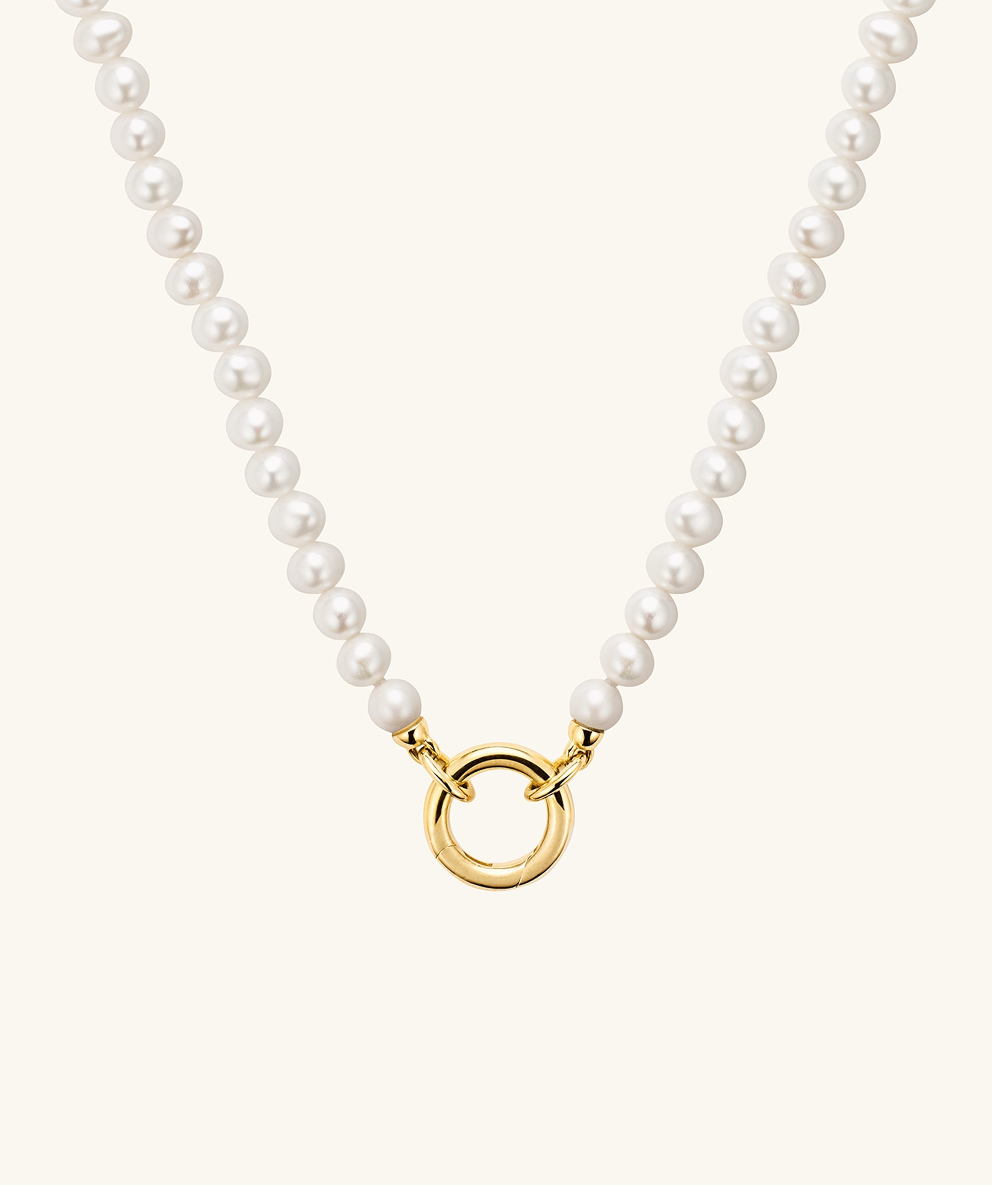 Pearl Necklace With Vermeil Enhancer: A handcrafted necklace featuring a gold vermeil ring and responsibly sourced freshwater pearls, perfect for customizable charm wear.