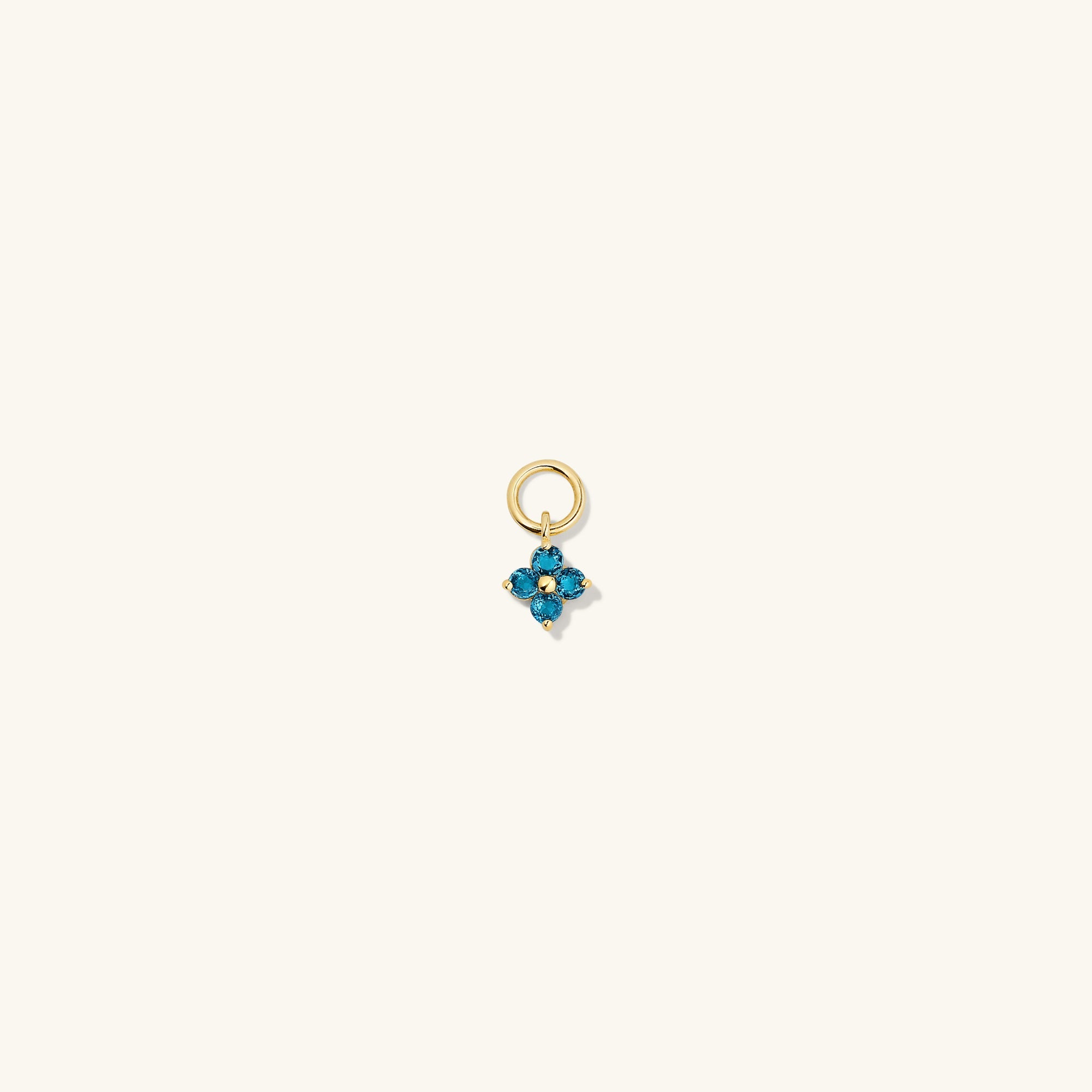 Single Gemstone Cluster Hoop Charm shown up close, highlighting its intricate design and ability to personalize and enhance everyday hoop earrings.