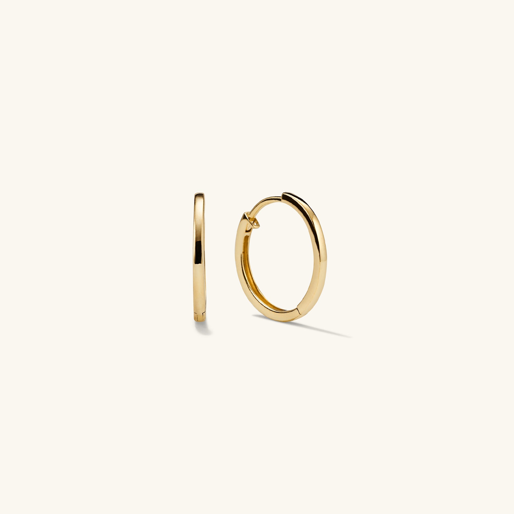 Easy Small Hoops: A pair of handcrafted 14k gold hoop earrings with a clicker closure, designed for everyday wear and maximum comfort.