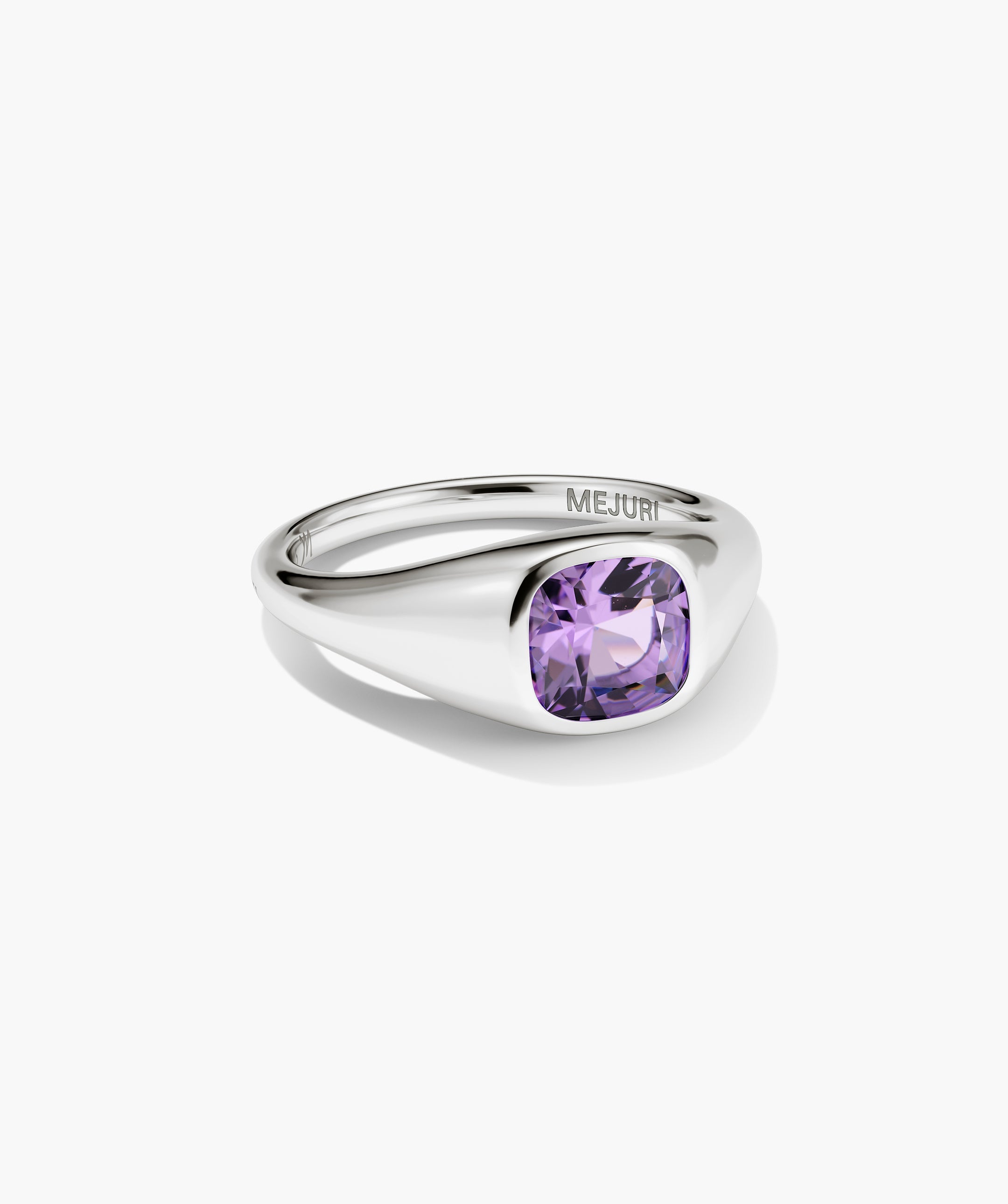 Jude Pinky Signet Ring with a cushion-cut purple gemstone set in a polished silver band, engraved with MEJURI inside.