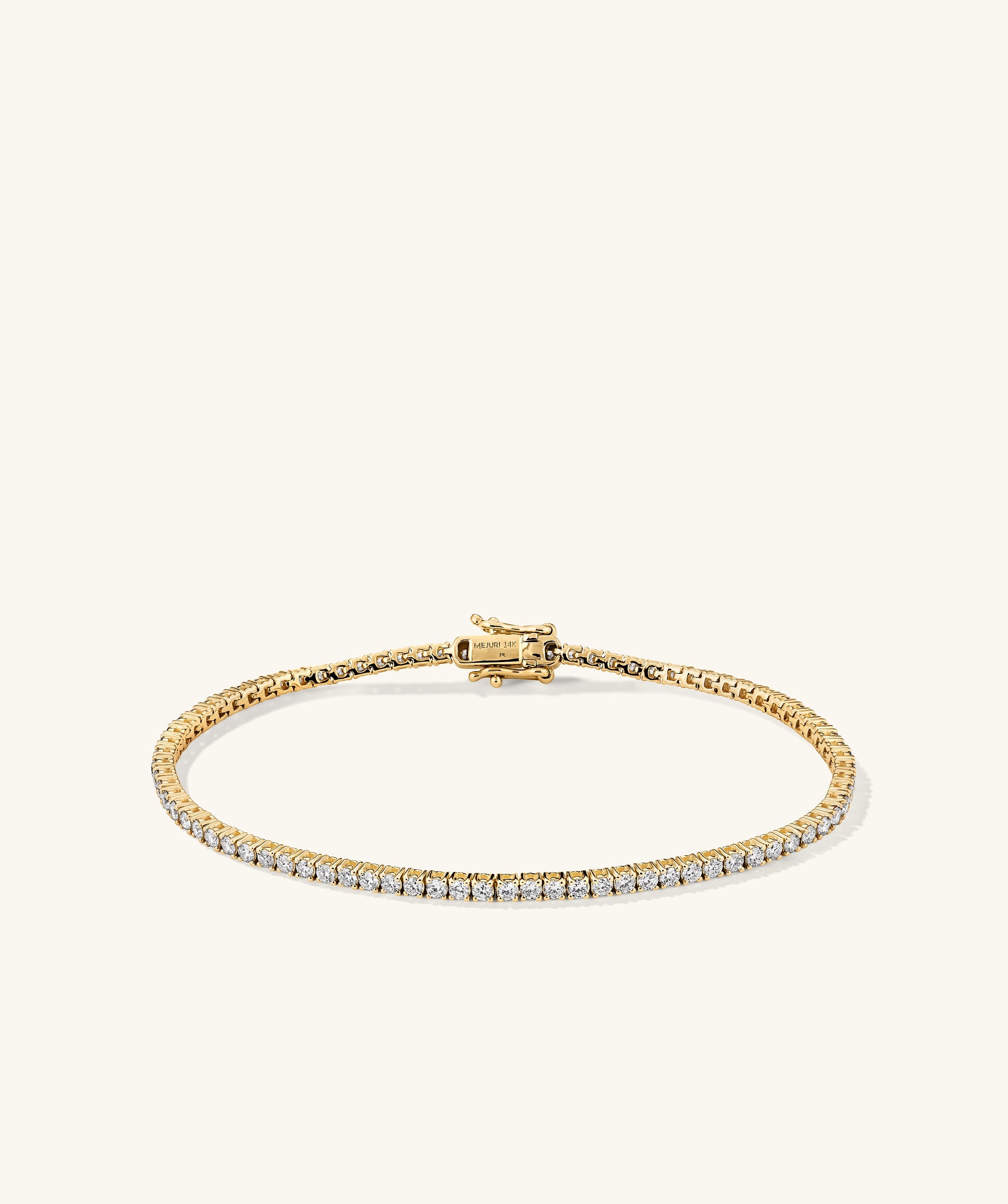 Lab Grown Diamond Tennis Bracelet 1.8mm, featuring 14k solid gold and lab-grown diamonds. Handcrafted with a secure clasp and safety arms for easy wear.