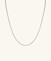 Lab Grown Diamond Tennis Necklace 1.8mm, featuring a close-up of a delicate 14k gold chain adorned with sparkling lab grown diamonds.