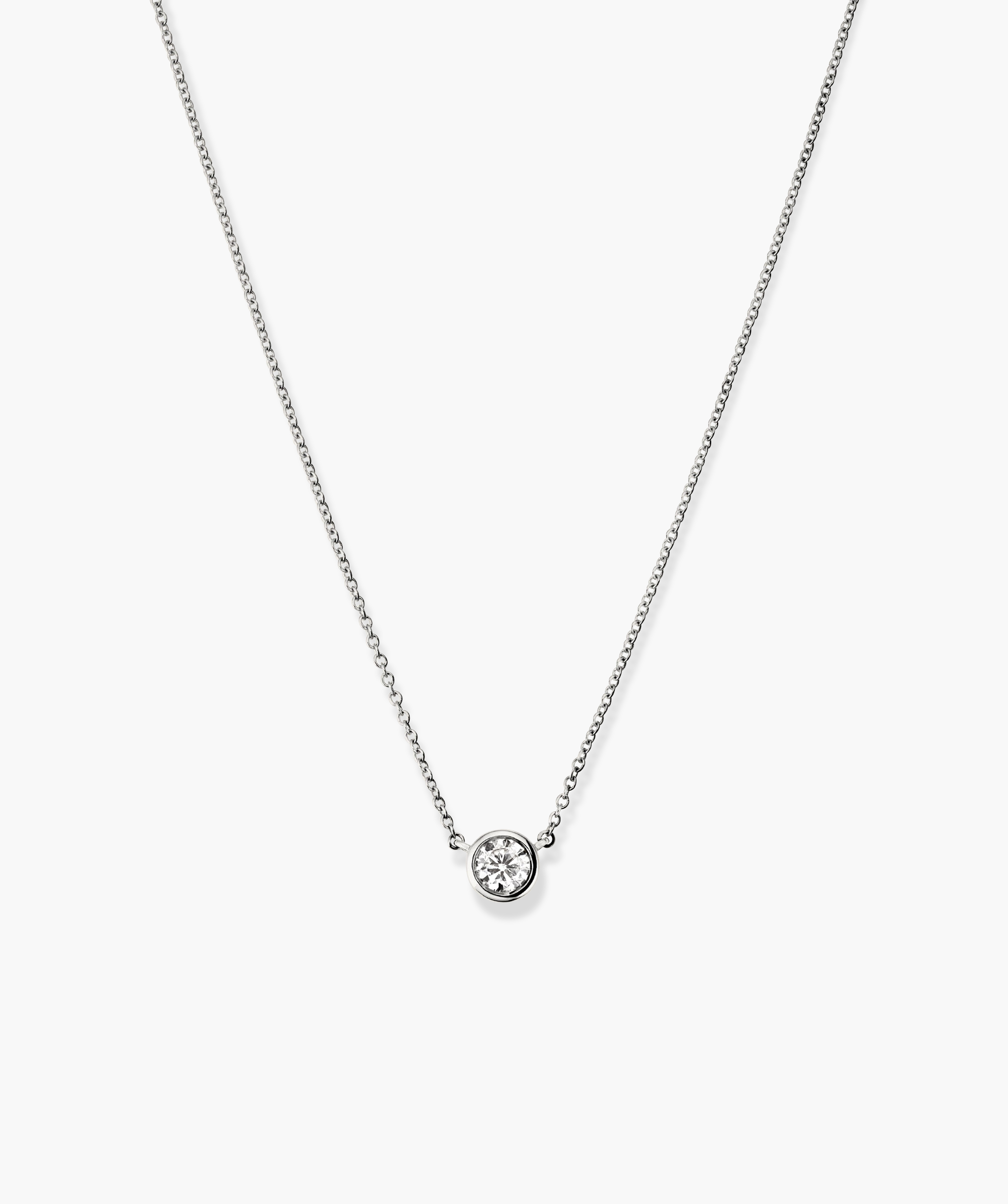 Bezel Lab Grown Diamond Necklace: A close-up of a 14k solid gold necklace with a bezel-set, lab-grown diamond pendant on a delicate chain.