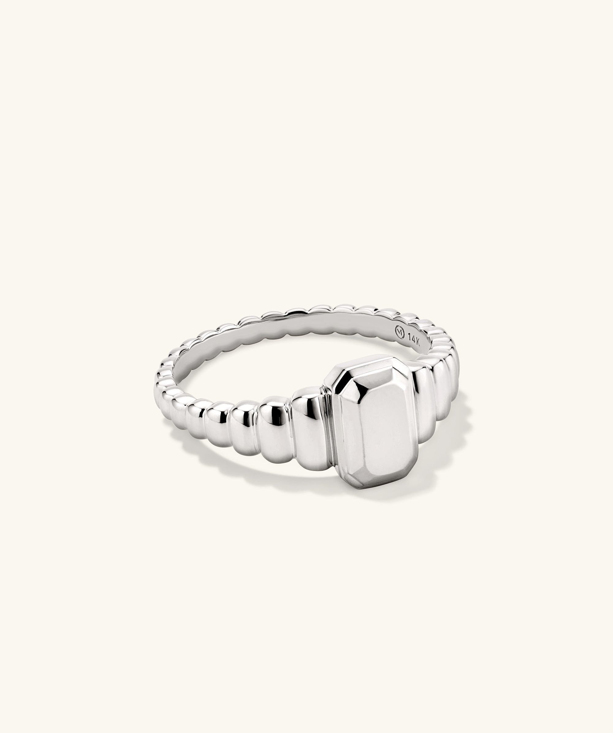 Charlotte Step Cut Signet Ring with an engravable square stone, adding texture and elegance to any outfit.