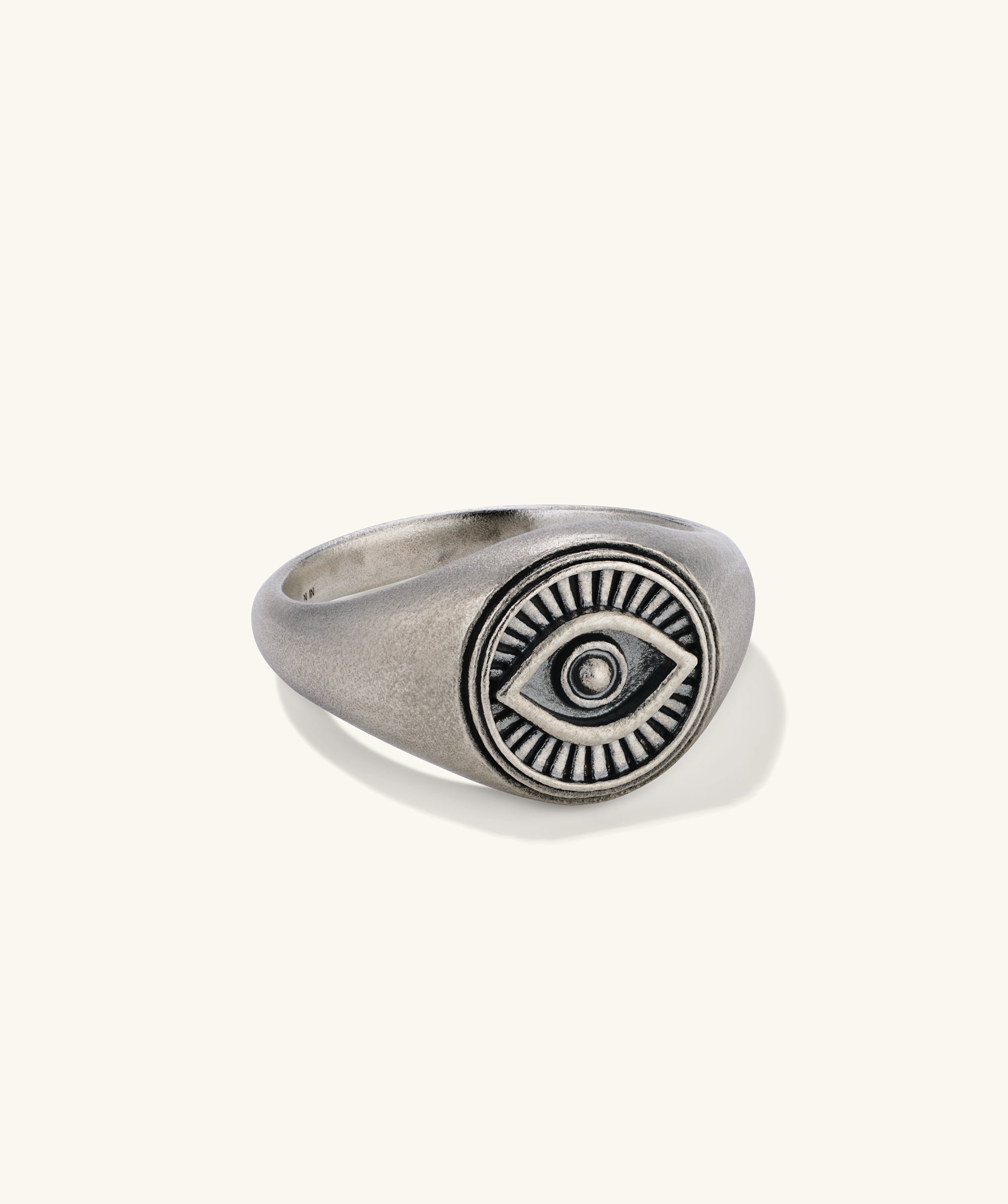 Courage Signet Ring: Silver ring featuring a central eye design, symbolizing protection against envy and evil.