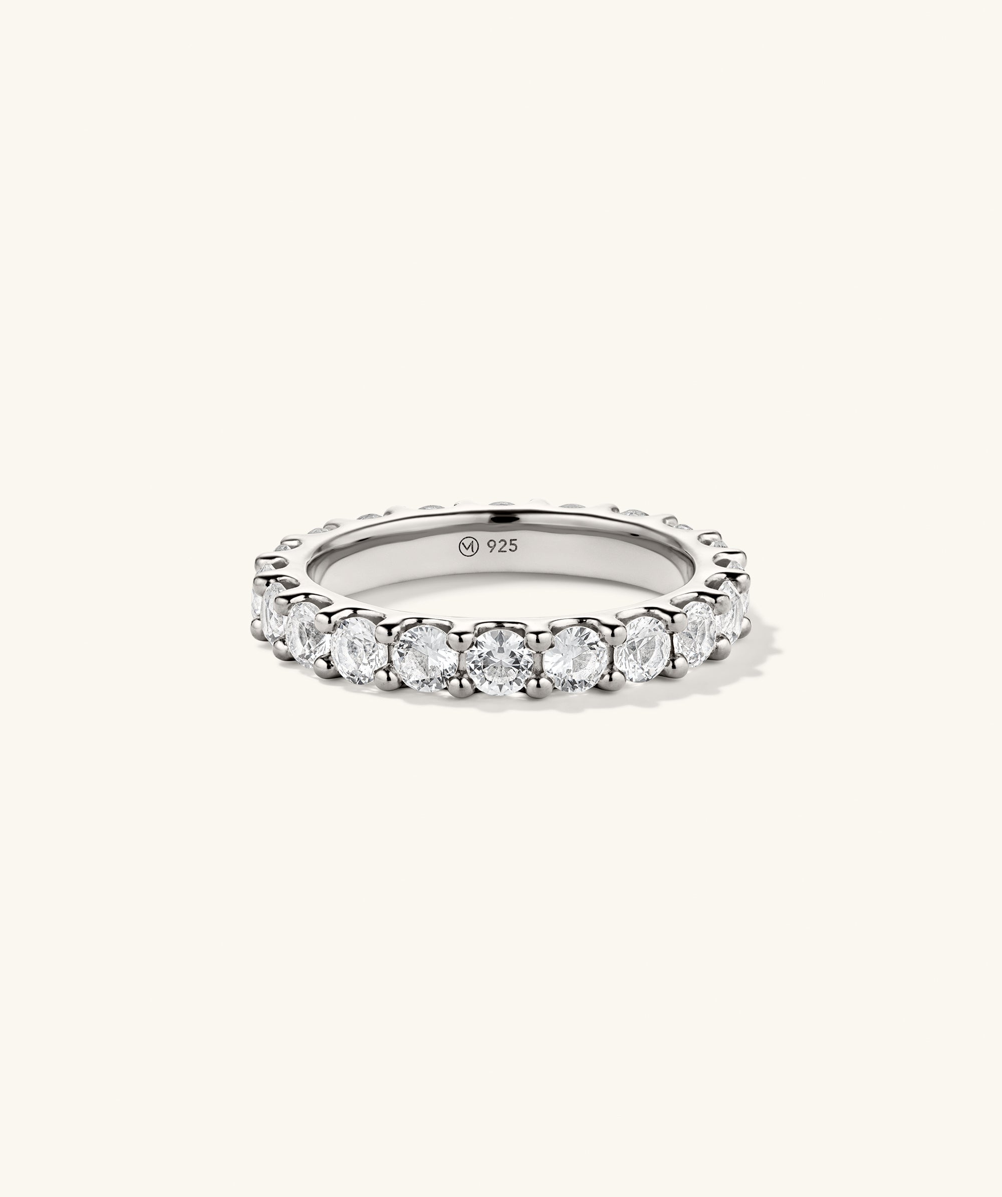 Aurora Lab Grown Sapphire Eternity Ring showcasing sparkling diamonds and sapphires set in a sleek platinum band, highlighted in a close-up view.