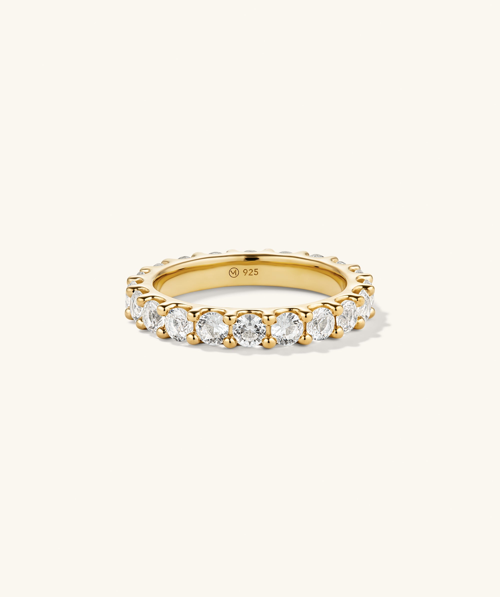 Aurora Lab Grown Sapphire Eternity Ring featuring lab grown sapphires encircling a gold band, embellished with diamonds, showcasing a luxurious, continuous design.