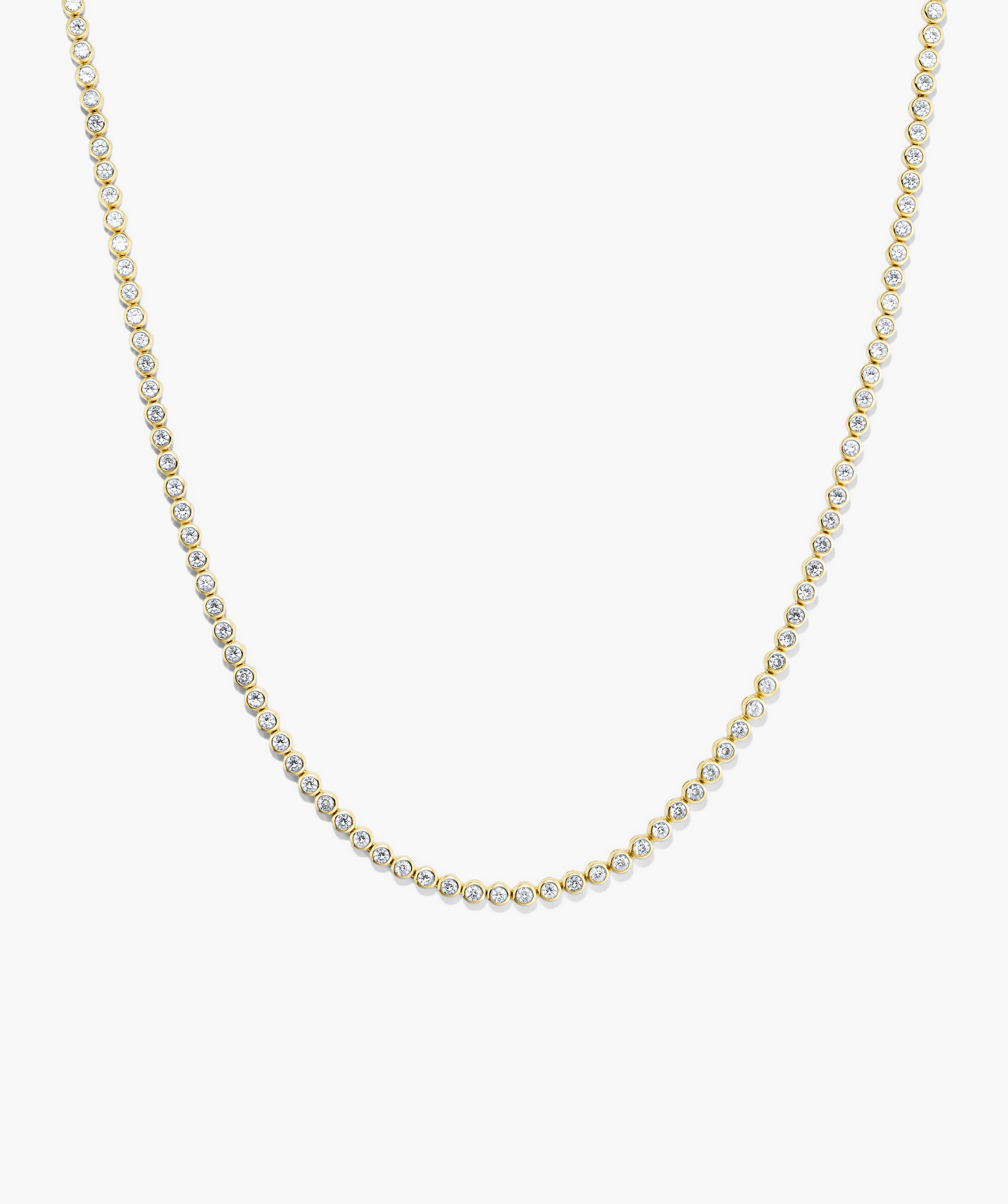 Zadie Bezel Lab Grown Sapphire Tennis Necklace featuring a gold chain with diamonds, showcasing a luxurious bezel setting for ultimate shine.