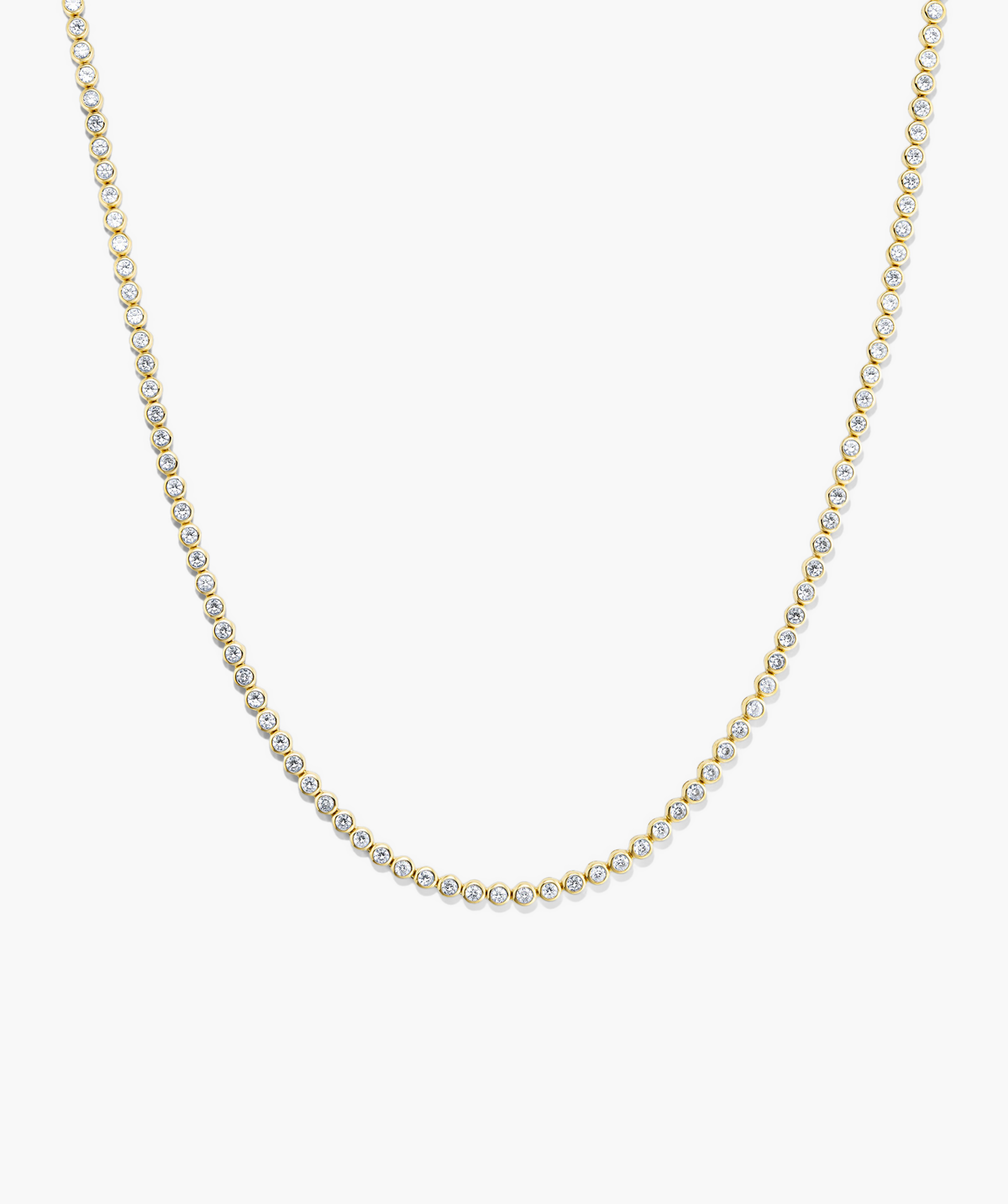 Zadie Bezel Lab Grown Sapphire Tennis Necklace featuring a gold chain with diamonds, showcasing a luxurious bezel setting for ultimate shine.