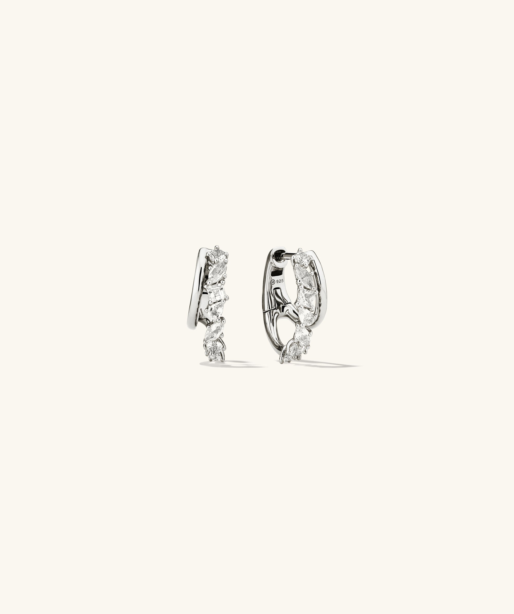 Ella Double Hoop earrings featuring lab grown sapphires in pear, marquise, round, princess, and square cuts, with a simple thin hoop attached.