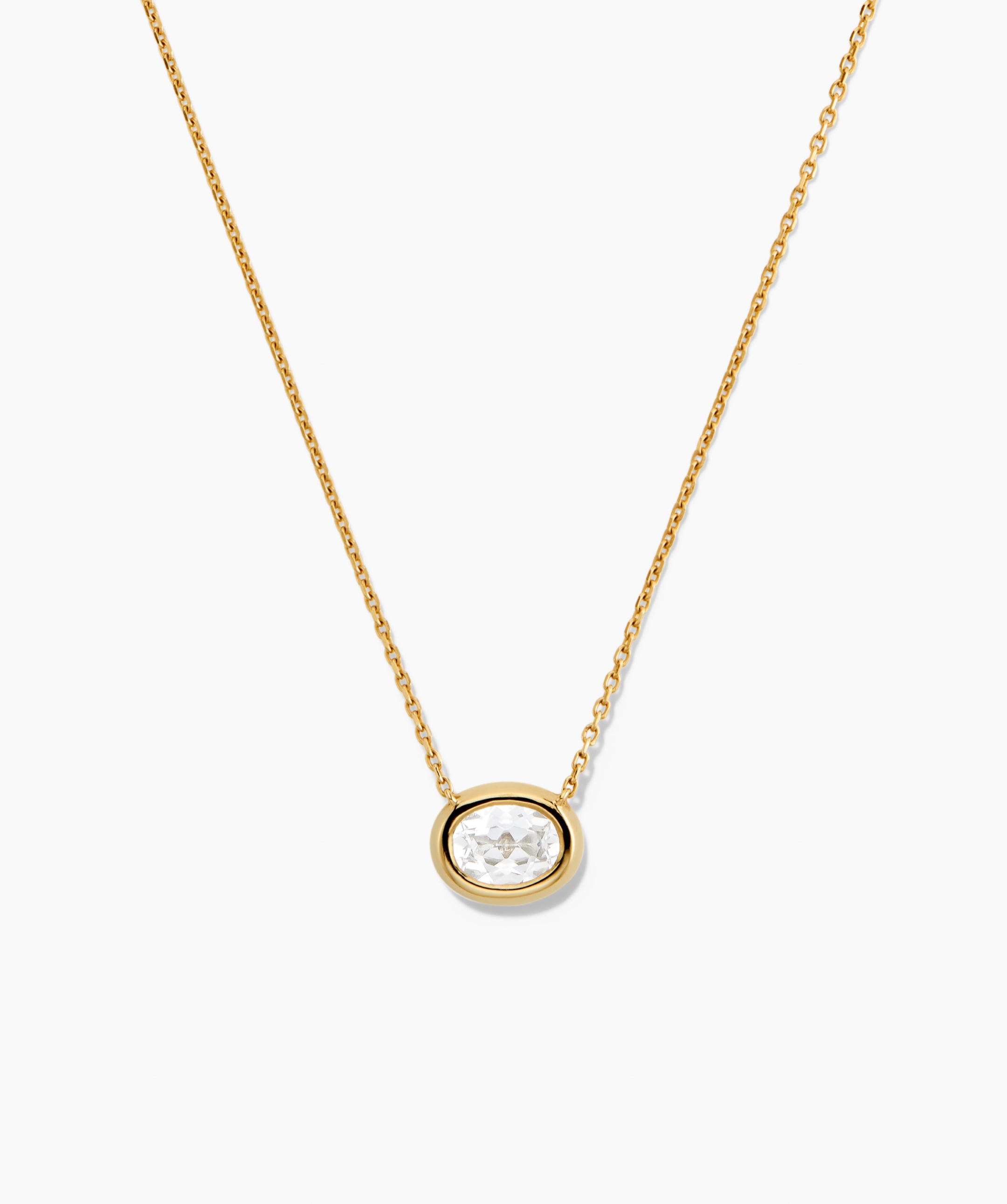 Lucia Necklace: A delicate gold chain featuring an oval bezel-set lab-grown sapphire pendant, perfect as a signature piece for any ensemble.