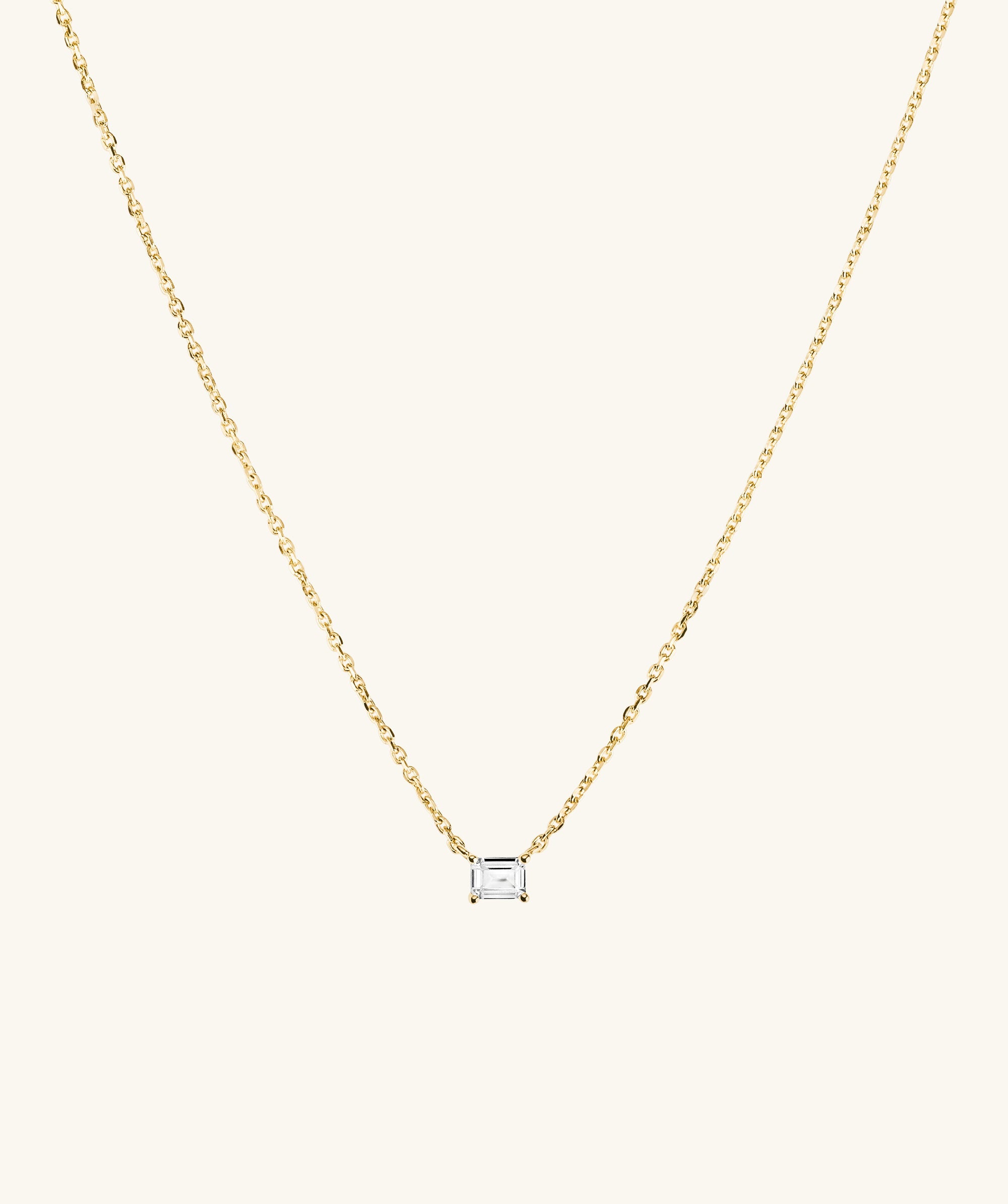 Lab Grown Sapphire Baguette Necklace featuring a gold chain and a diamond pendant, showcasing an emerald-cut lab-grown sapphire for everyday elegance.