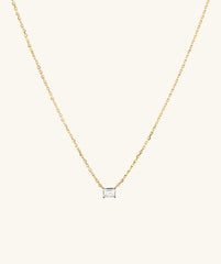 Lab Grown Sapphire Baguette Necklace featuring a gold chain and a diamond pendant, showcasing an emerald-cut lab-grown sapphire for everyday elegance.