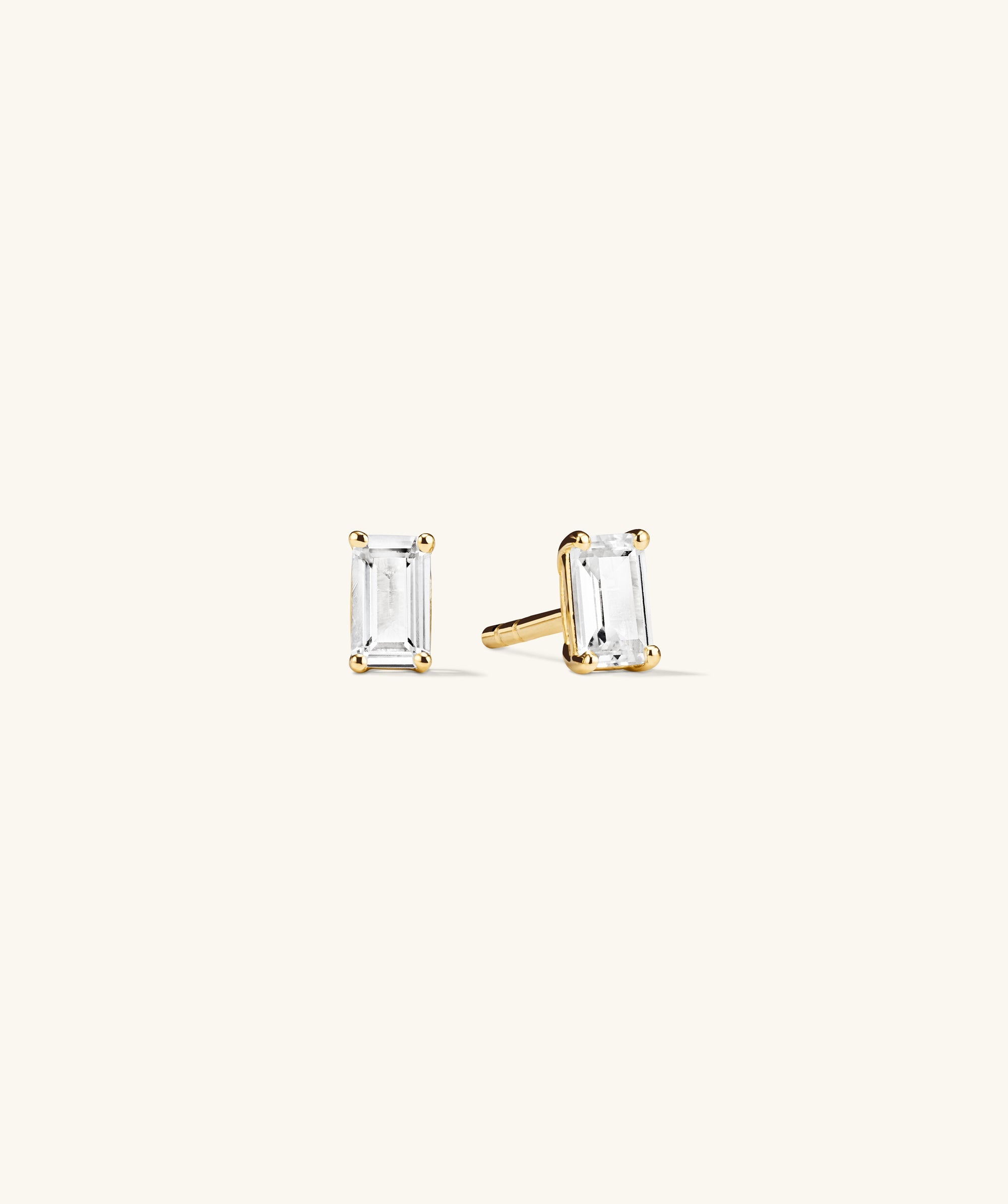 Lab Grown Sapphire Emerald Cut Studs, featuring a classic design with square-cut sapphire stones, perfect for wearing alone or stacking.