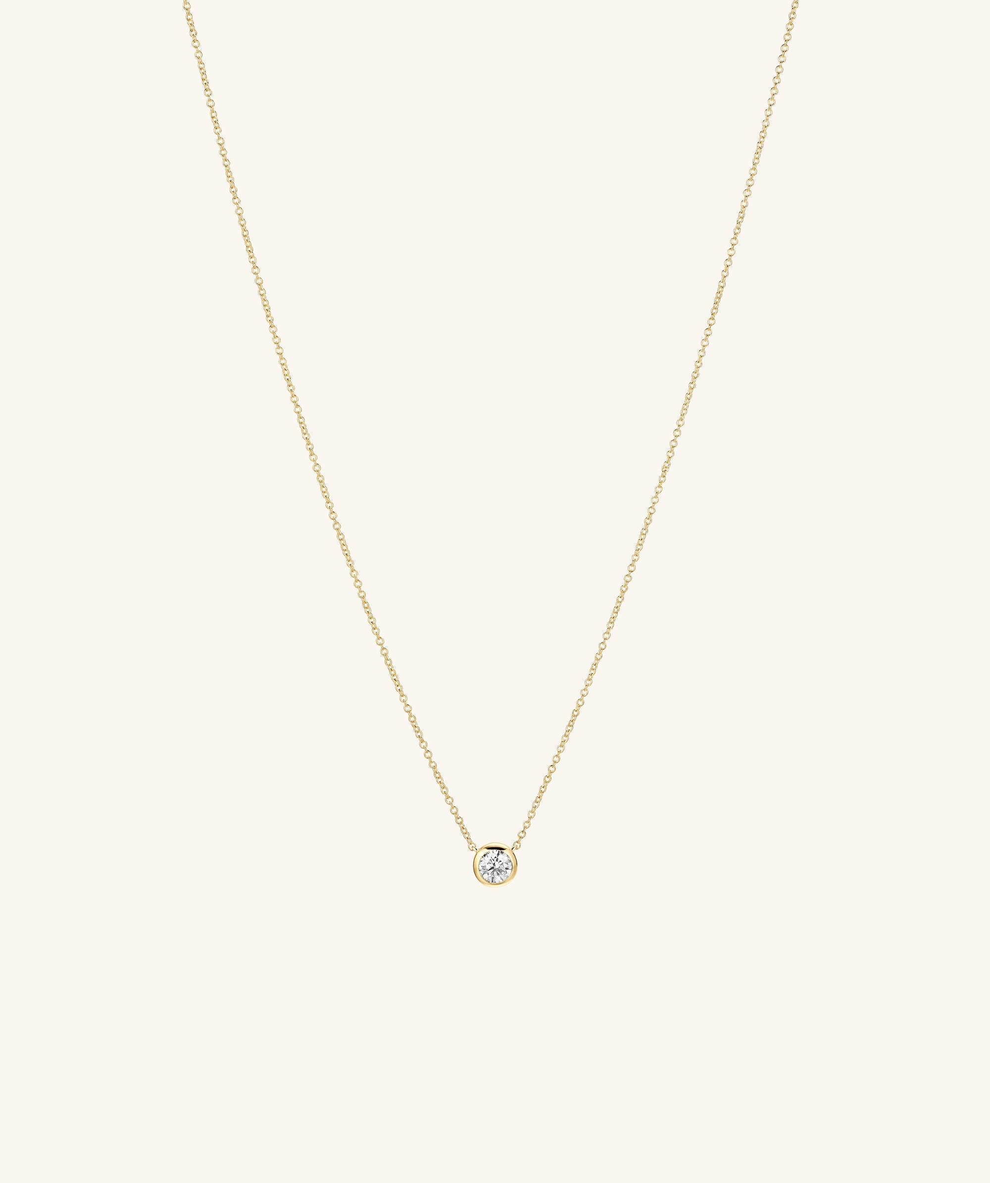 Large Diamond Necklace with a gold chain and a prominent diamond pendant, designed to be an heirloom-worthy fashion accessory.