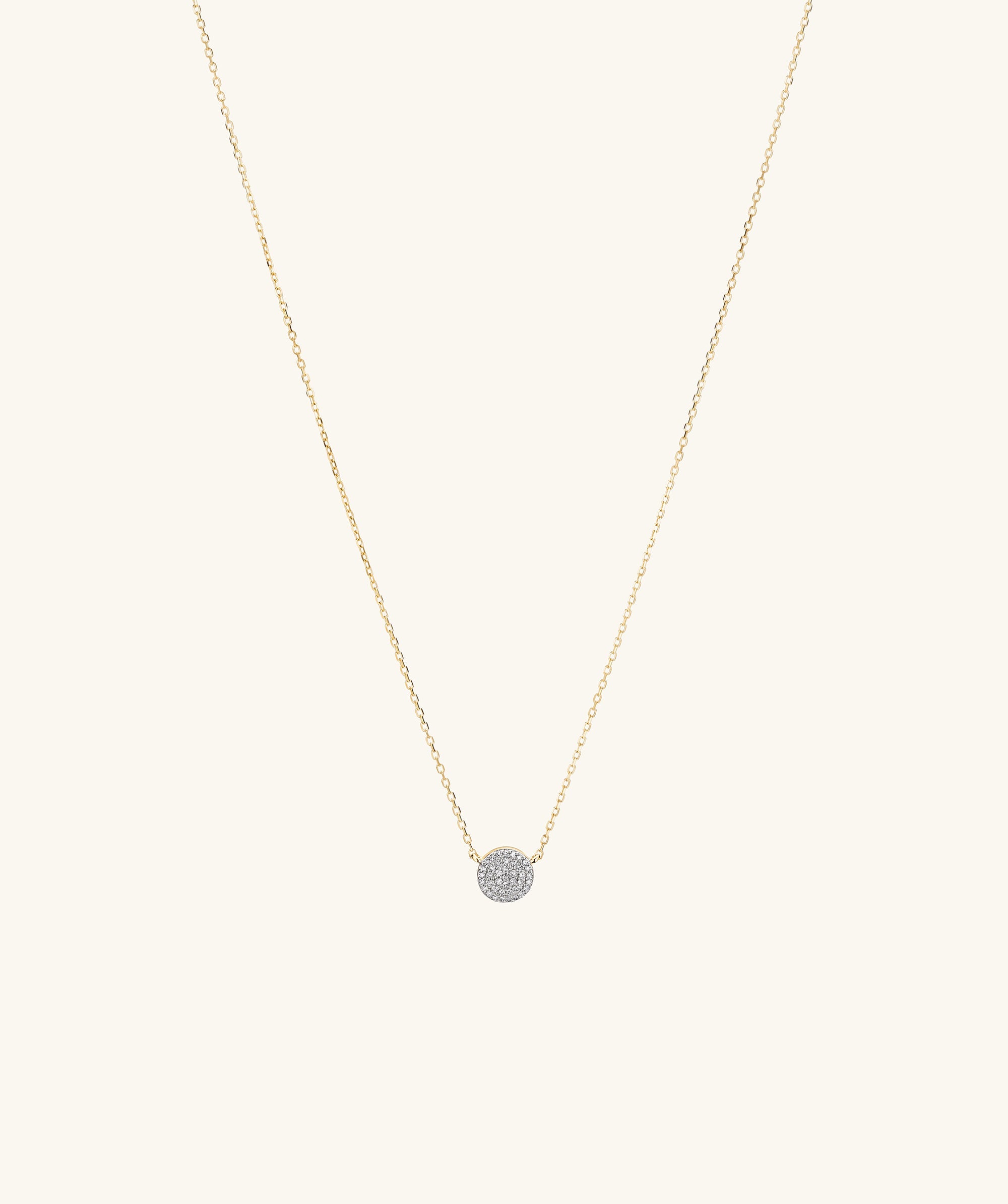 Large PavÃ© Diamond Round Necklace, featuring a 14k solid gold chain and a round diamond pendant with pavÃ© detailing, shown in a close-up view.