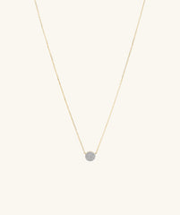 Large PavÃ© Diamond Round Necklace, featuring a 14k solid gold chain and a round diamond pendant with pavÃ© detailing, shown in a close-up view.