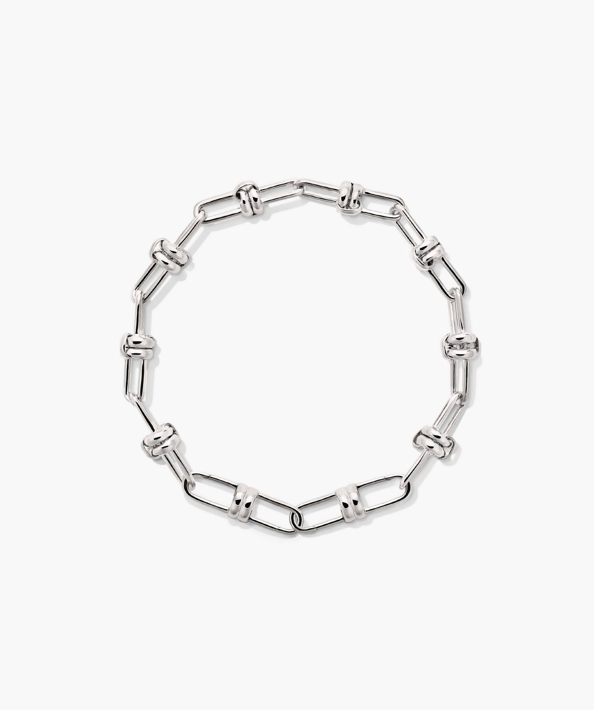 Mejuri Custom Chain Bracelet: A silver chain with interlocking links, designed for customization with charms, offering a unique and personal accessory experience.