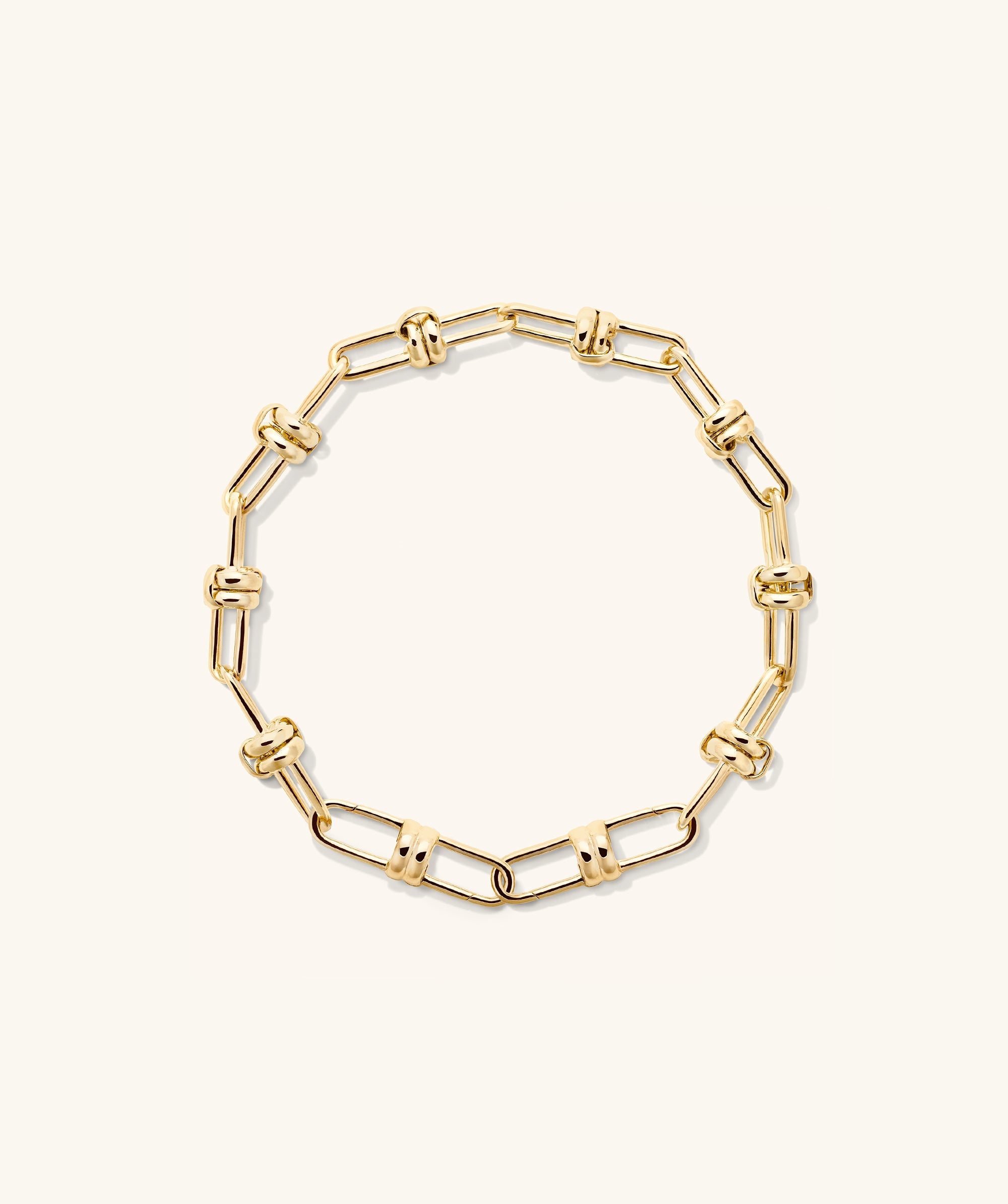 Mejuri Custom Chain Bracelet: a gold chain with interlocking links designed for customization, allowing for charm additions and personalized styling.