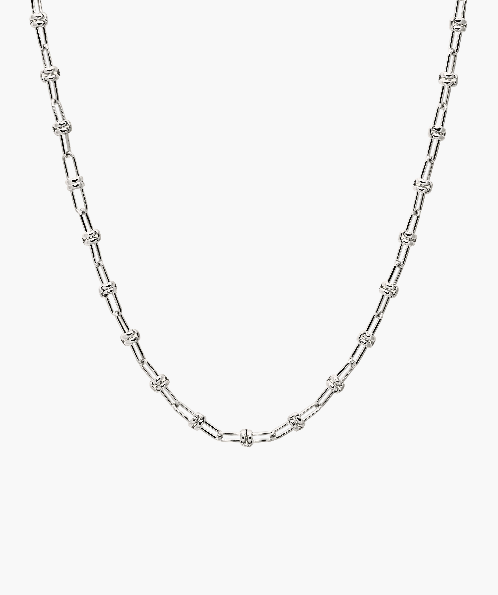 Multi Way Chain Necklace: Close-up of a silver chain with a knot, showcasing versatile links for customizable styles, designed for unique personalization.