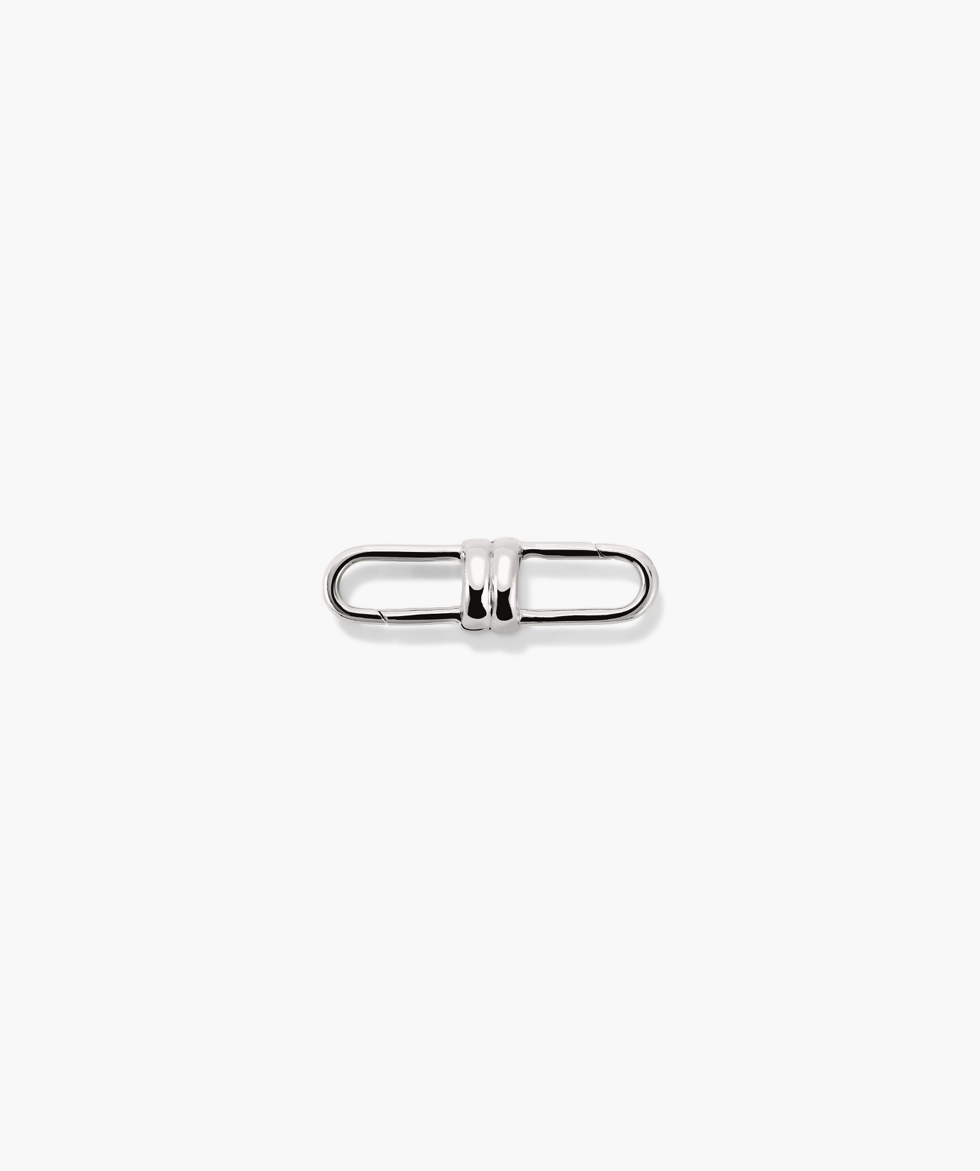 Mejuri Custom Chain Enhancer: A close-up of a silver metal clasp designed to attach to various chains for added versatility and style.