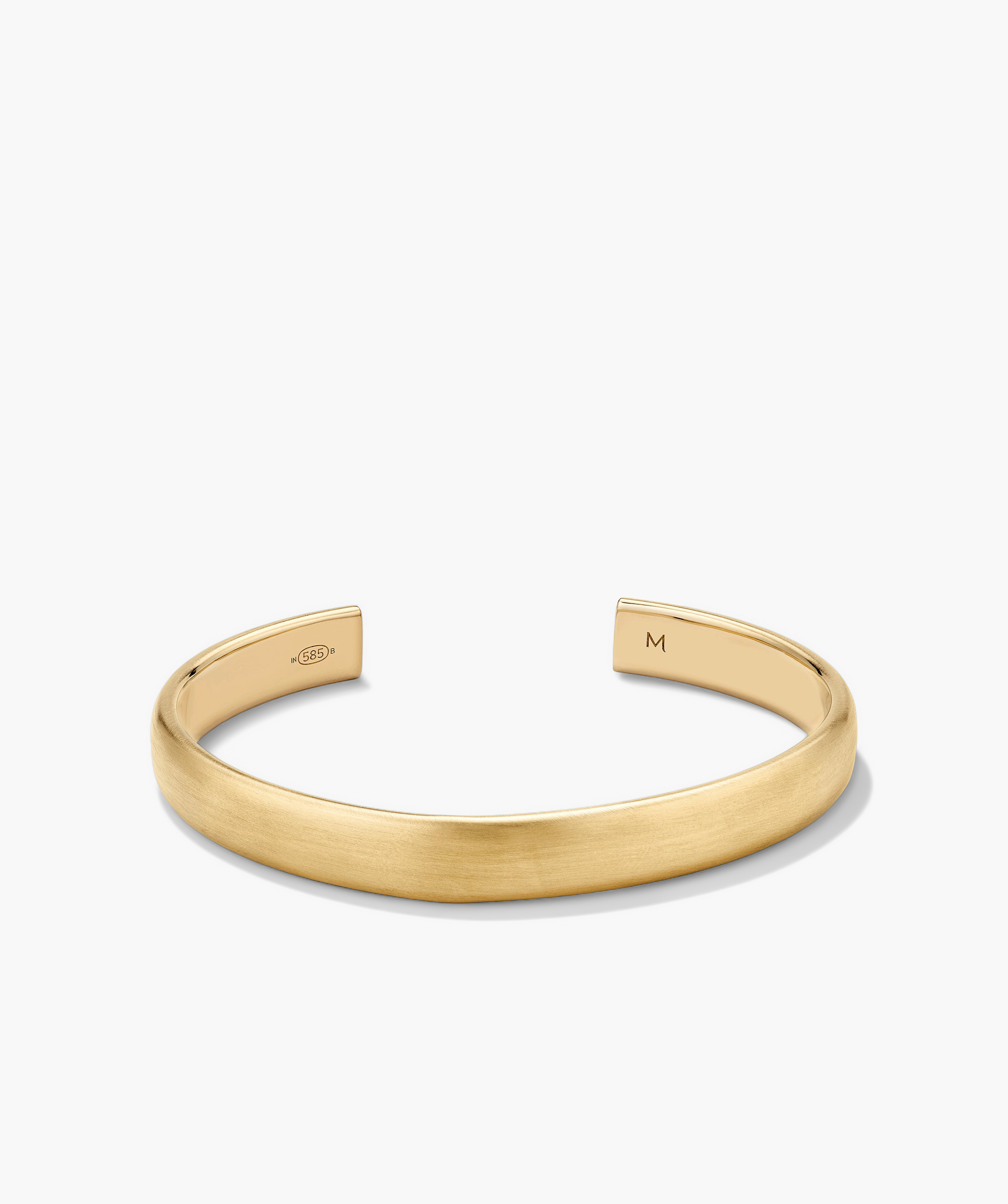 Bold Cuff: A gold bracelet with a simple, bold silhouette.