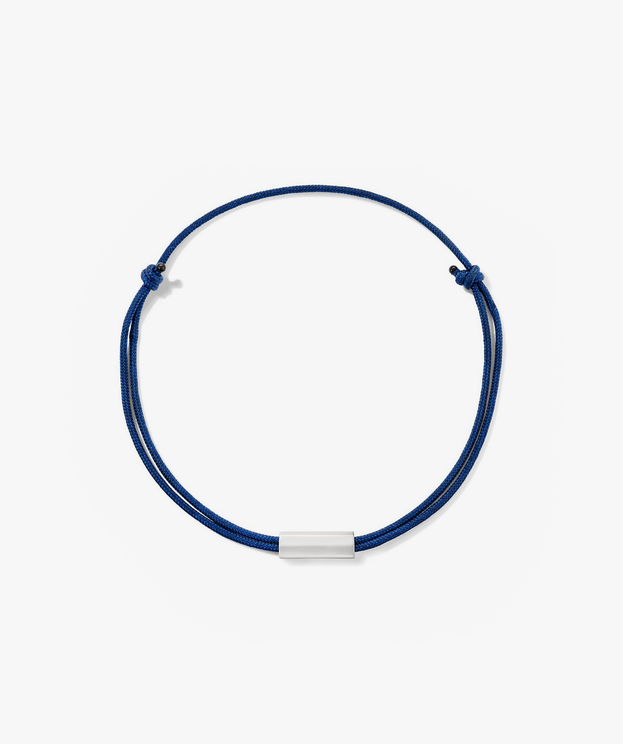 Bar Cord Bracelet featuring a sleek silver bar on a finely braided cord, perfect for adding a touch of elegance to your style.