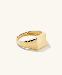 Square Signet Ring: A bold gold ring featuring a square design, ideal for making a statement in any jewelry collection.