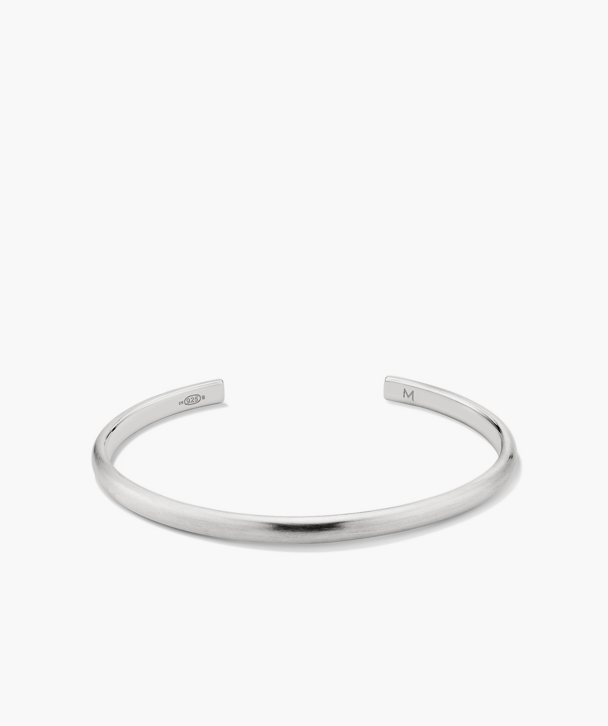 Slim Cuff: A simple, elegant silver bracelet with a smooth finish, featuring a sleek, minimalist design, perfect for versatile fashion pairing.
