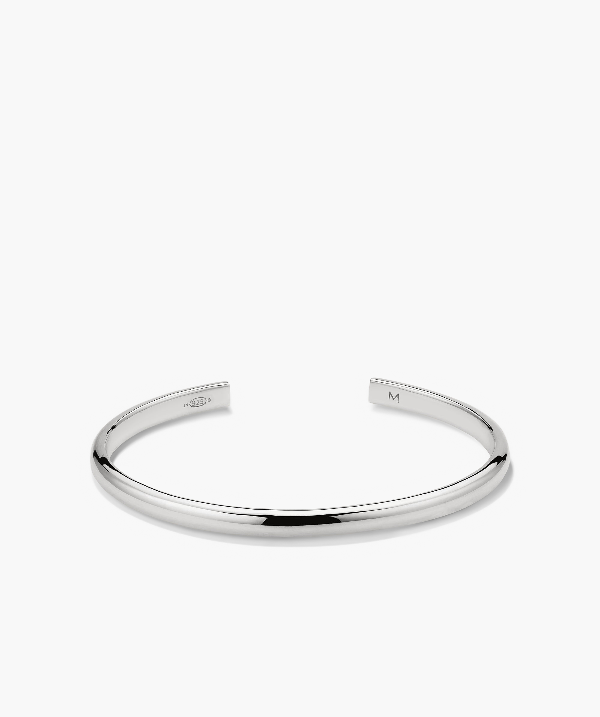 Slim Cuff: A sleek silver bracelet with two curved ends. Ideal for versatile styling, this fashion accessory has a simple, elegant silhouette.